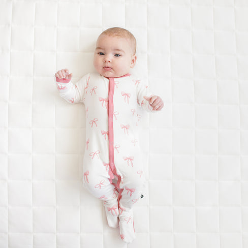Baby modeling Footie in Bow