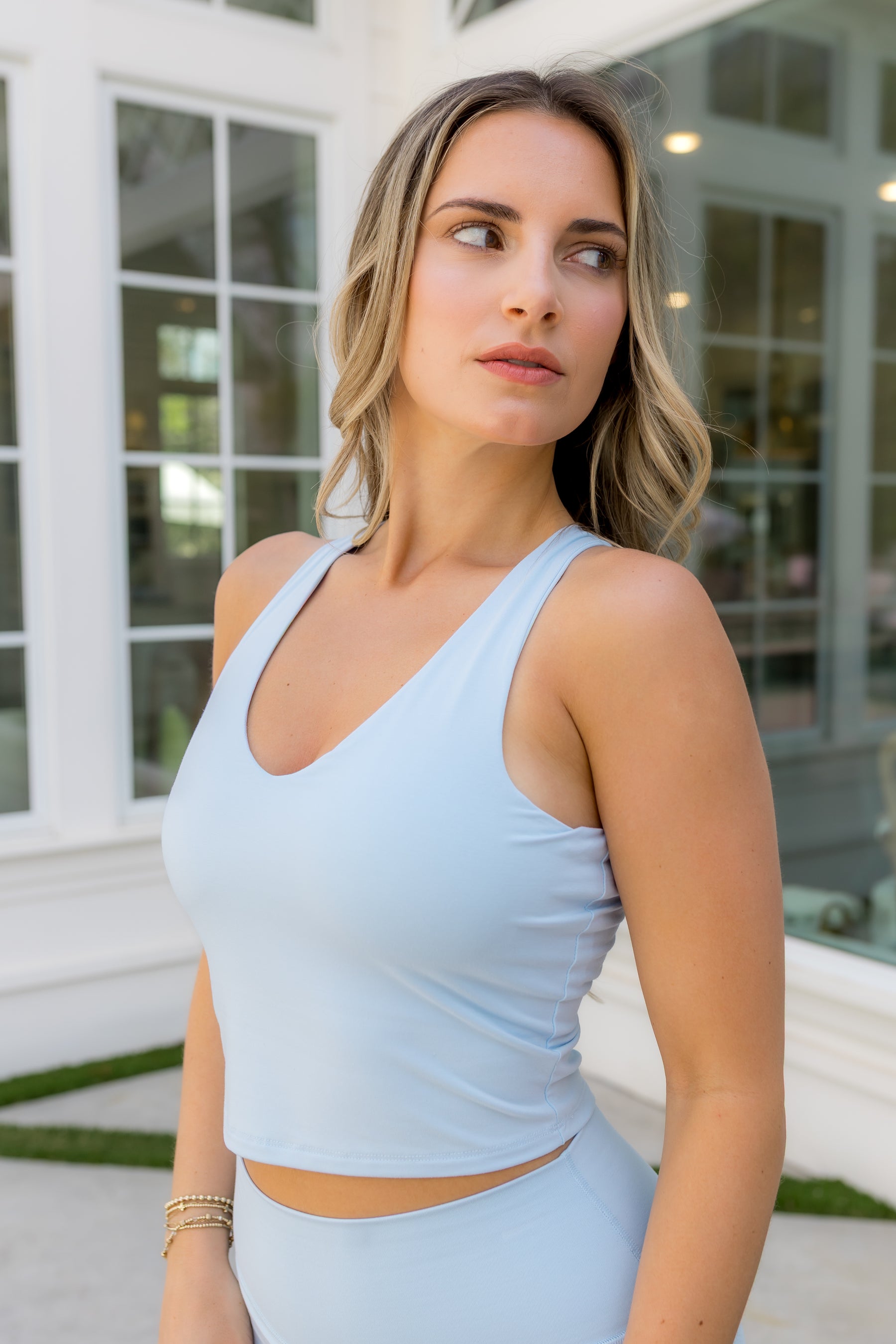Female modeling the Bamboo Flex Bra Tank in Breeze with matching skort
