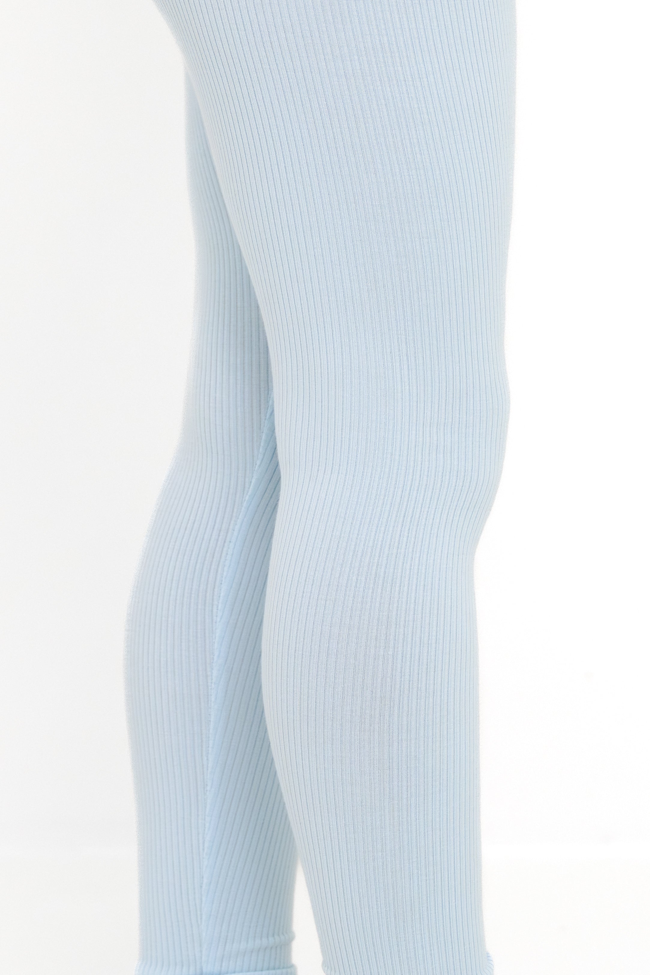 Close up of the ribbed fabric of the Ribbed Leggings in Breeze shown on a young girl model