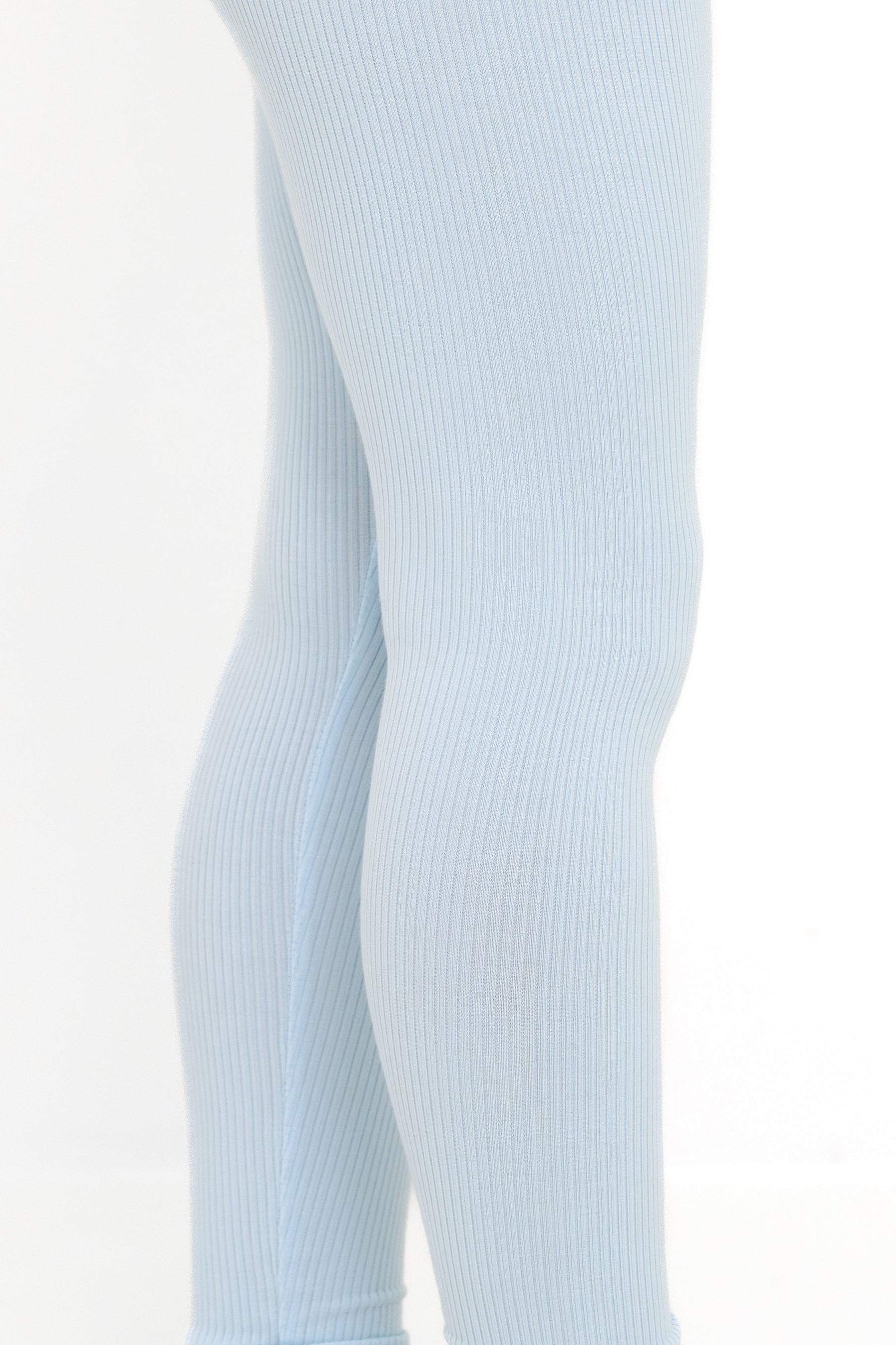 Close up of the ribbed fabric of the Ribbed Leggings in Breeze shown on a young girl model