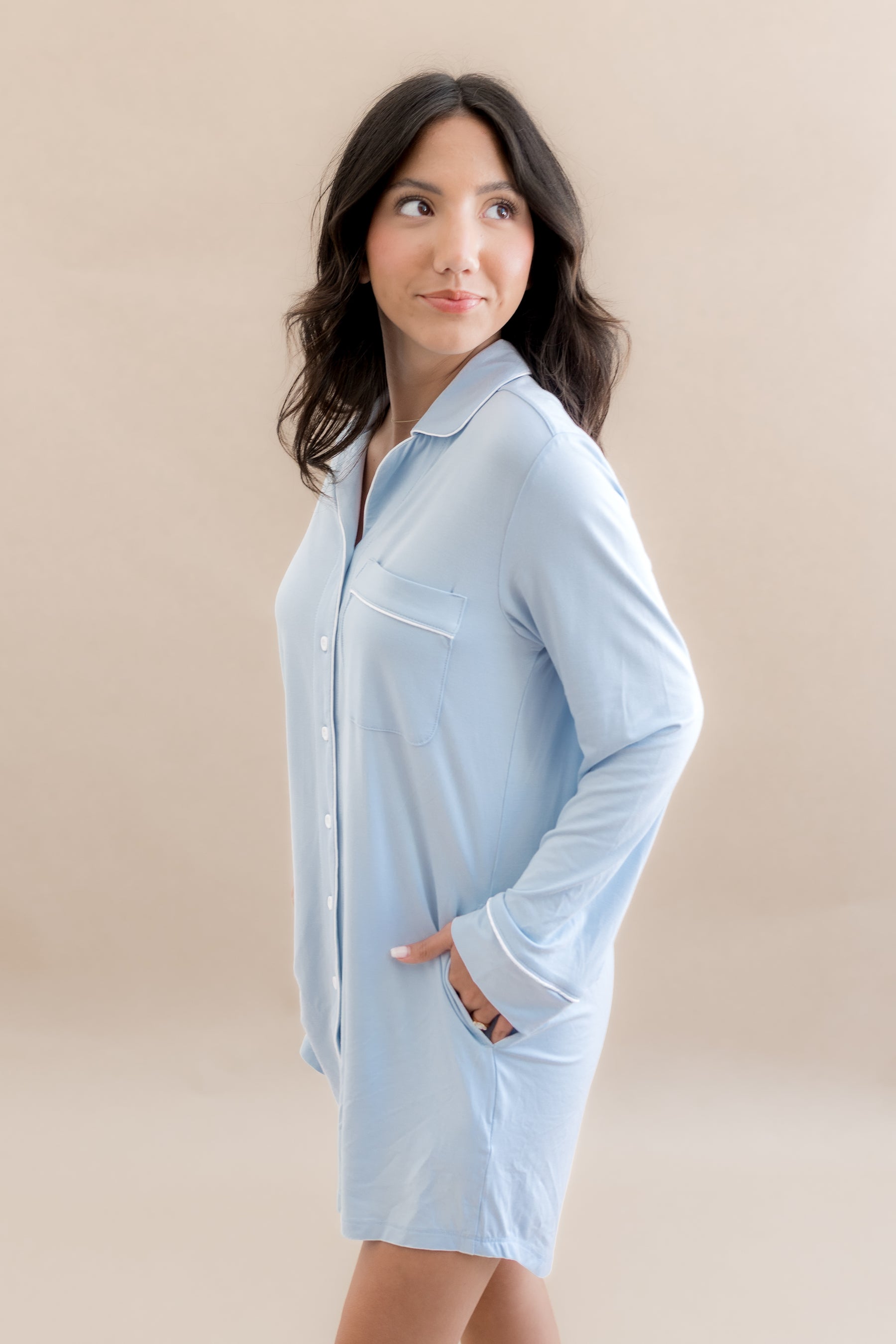 Female modeling the Long Sleeve Women’s Nightshirt in Breeze with hands in the side pockets