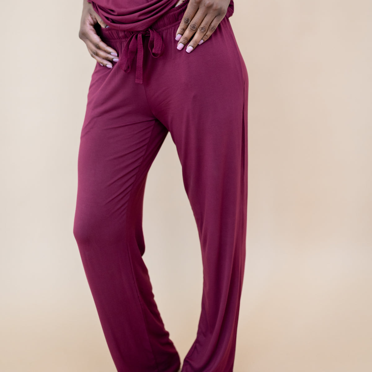 Close up of the Women's Lounge Pants in Burgundy on a model