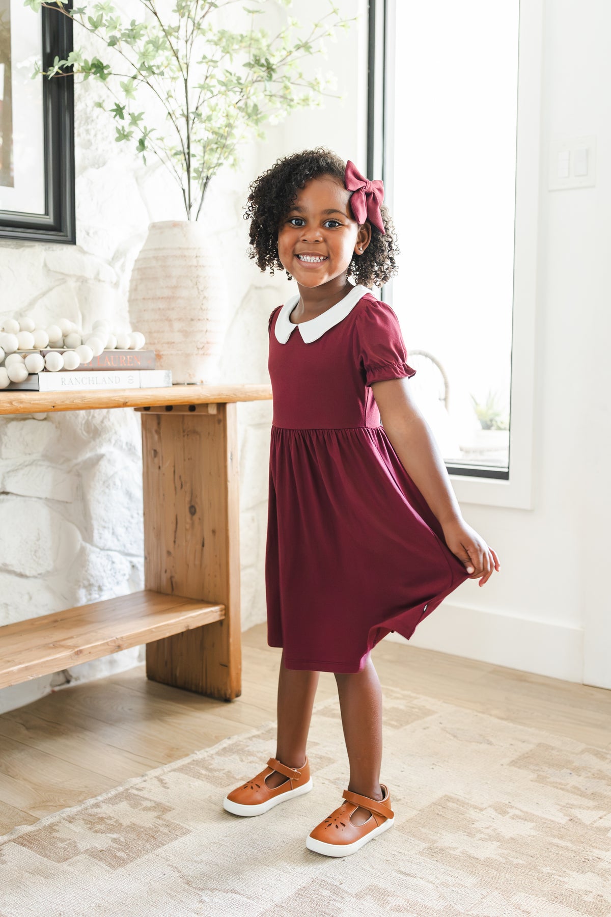 Girl wearing Peter Pan Collar Dress in Burgundy with Medium Alligator clip bow 