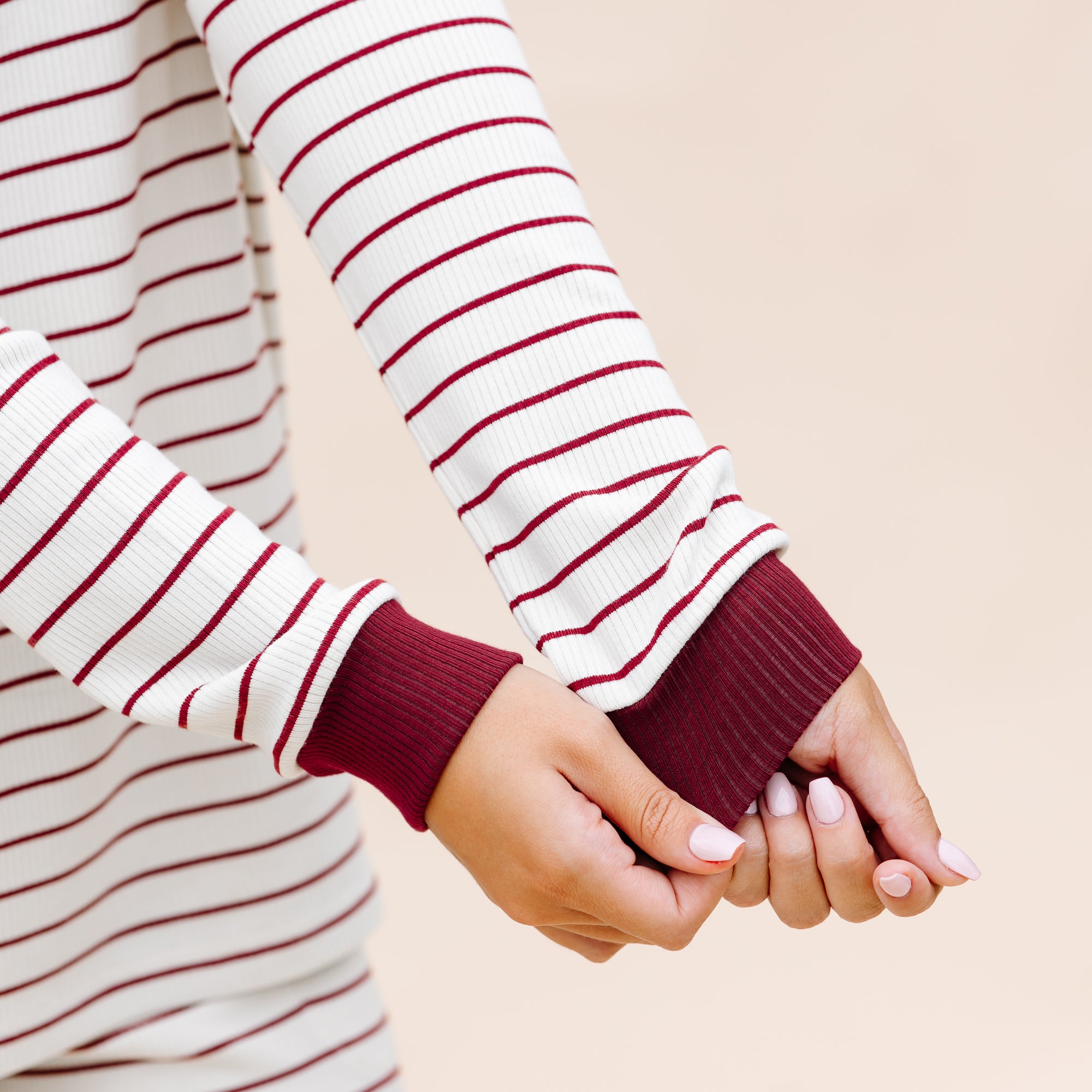 Close up of the burgundy ribbed wrist cuff on the Women’s Ribbed Henley Set in Burgundy Stripe