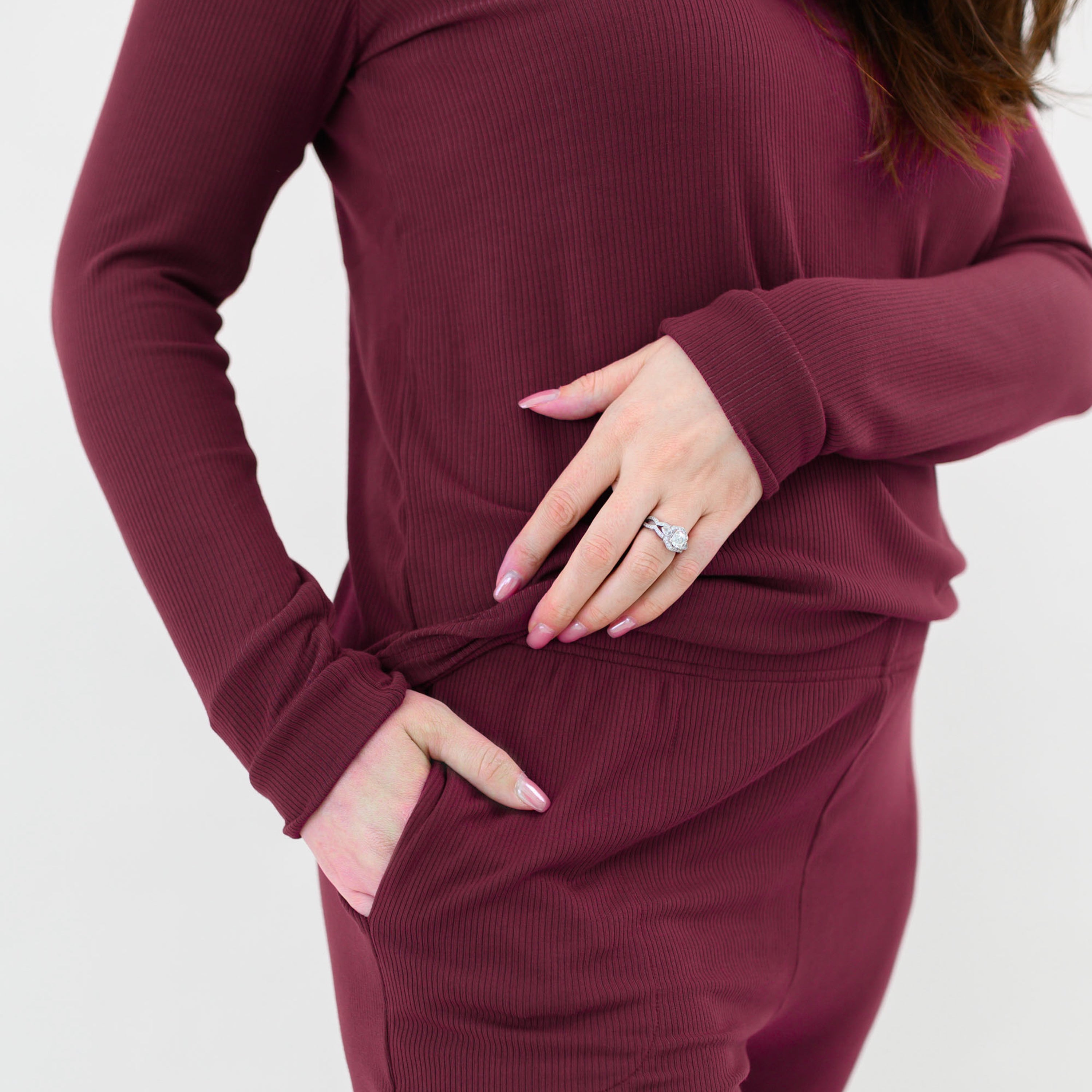 Close up of the pocket and waistband on the pants of the Women’s Ribbed Henley Set in Burgundy 