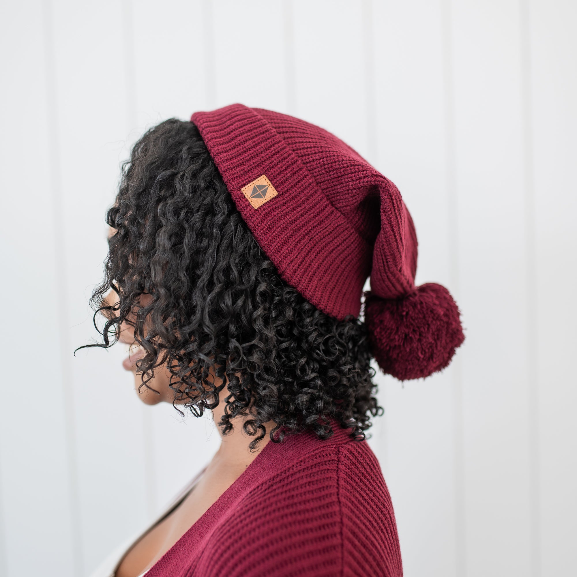 Chunky Knit Adult Pom Beanie in Burgundy shown on a female model