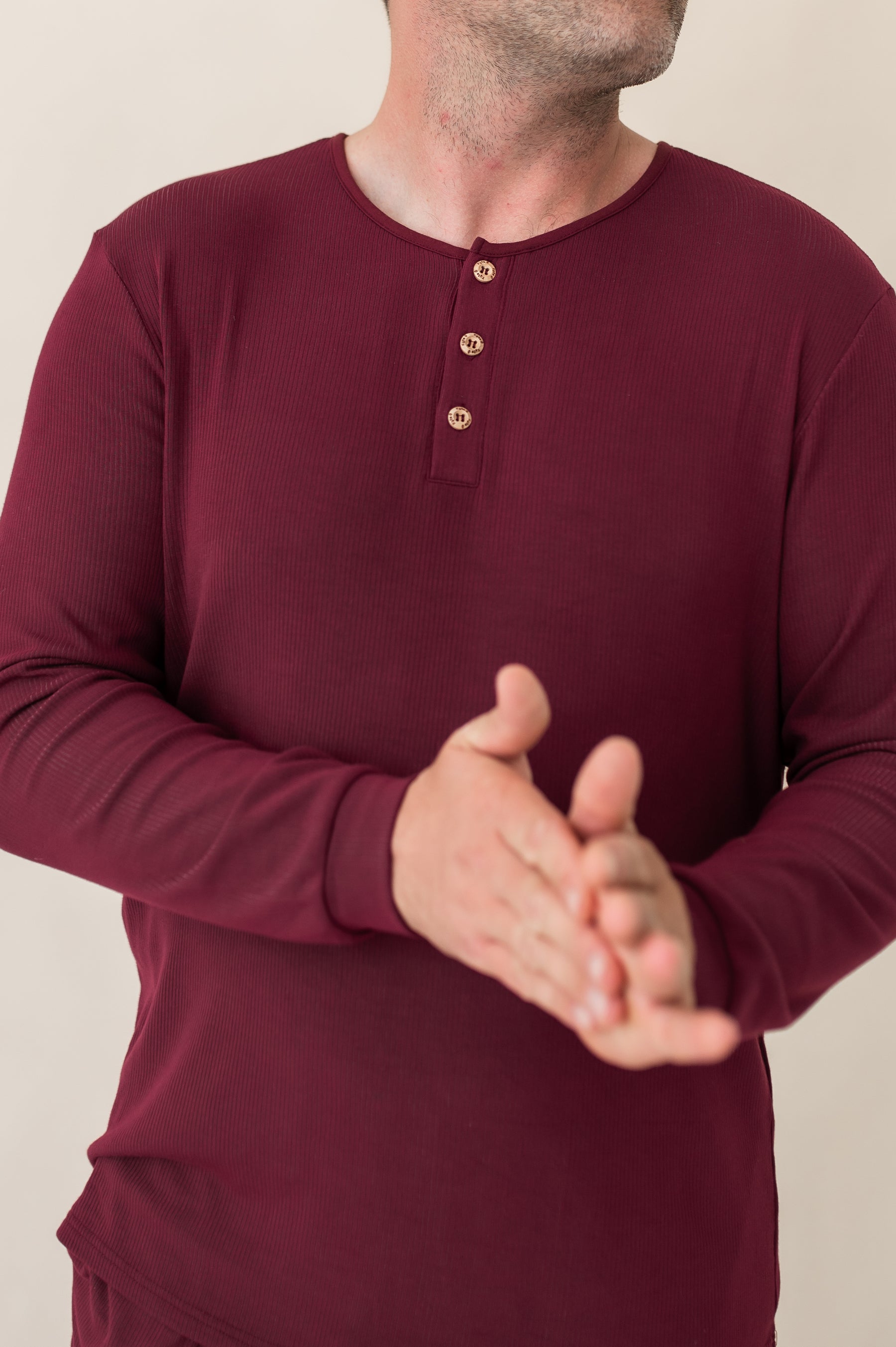 Close up of the button closure on the Men's Ribbed Henley Set in Burgundy
