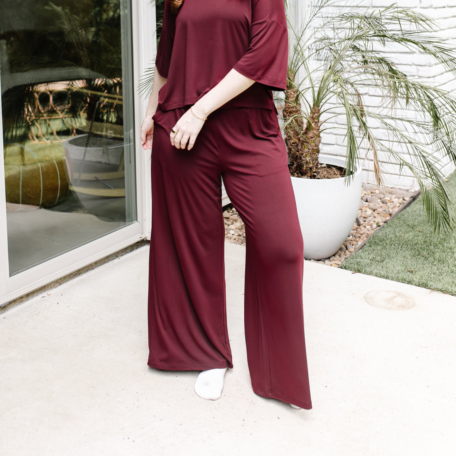 Women's Wide Leg Pant in Burgundy shown on a model