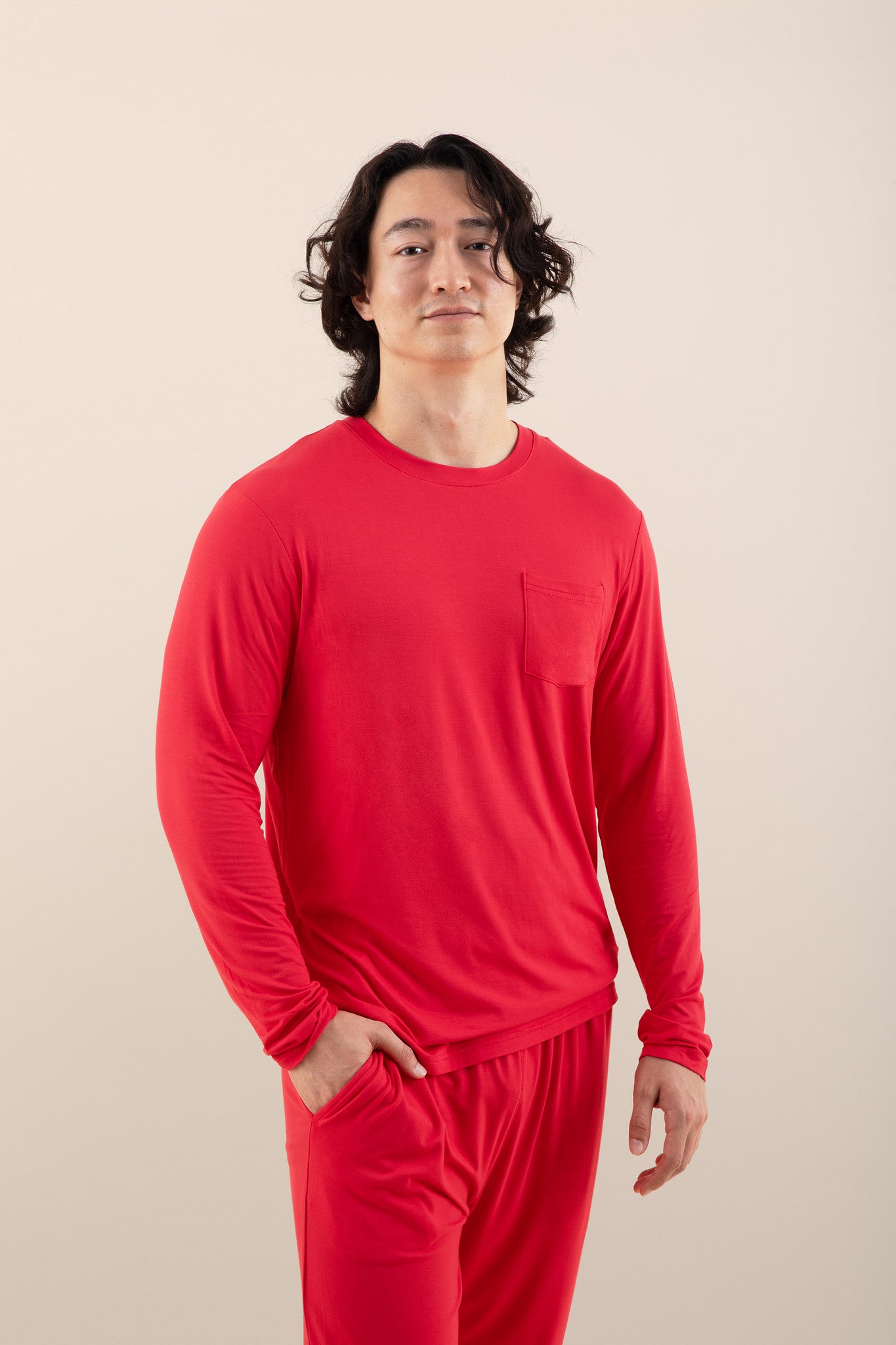 Male modeling the Men's Jogger Set in Cardinal with one hand in the pocket of the pants pocket