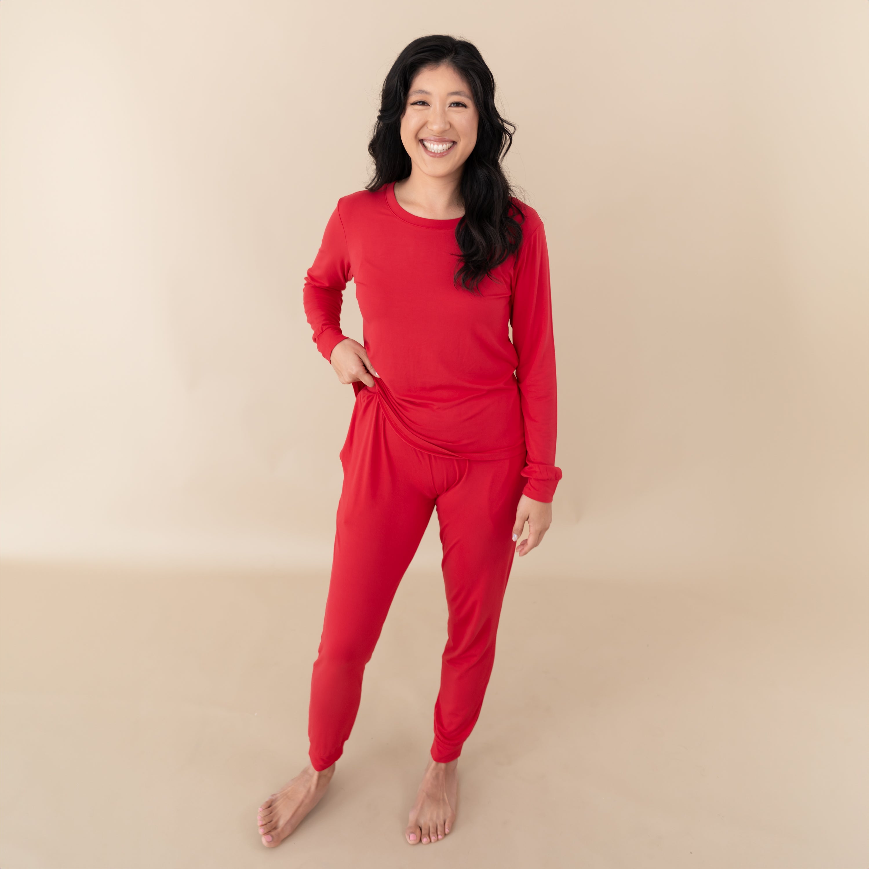 Woman modeling Women's Jogger Pajama Set in Cardinal with hand on hip