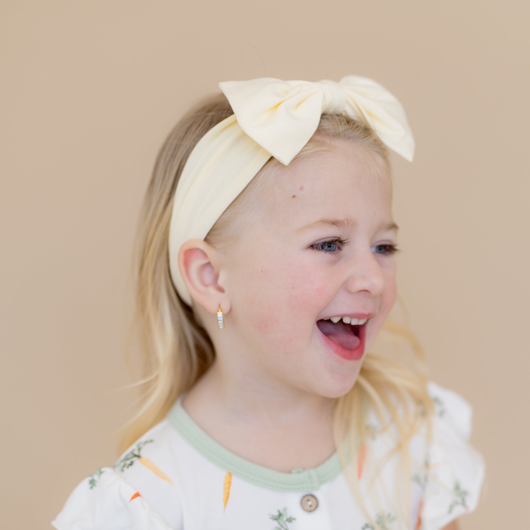 Young girl modeling the Bow Headband in Chamomile