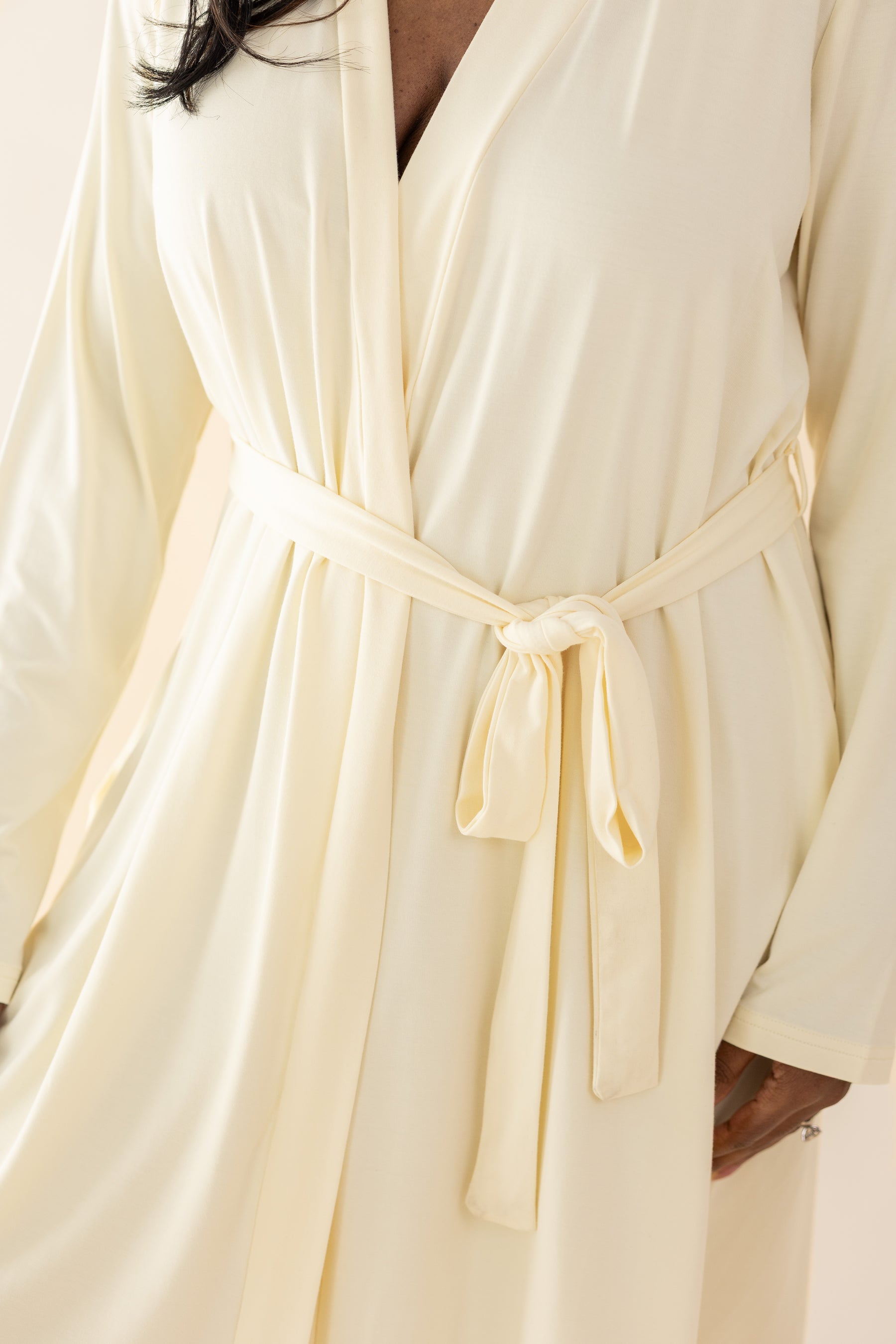 Yellow-colored robe with a belt being worn by a person