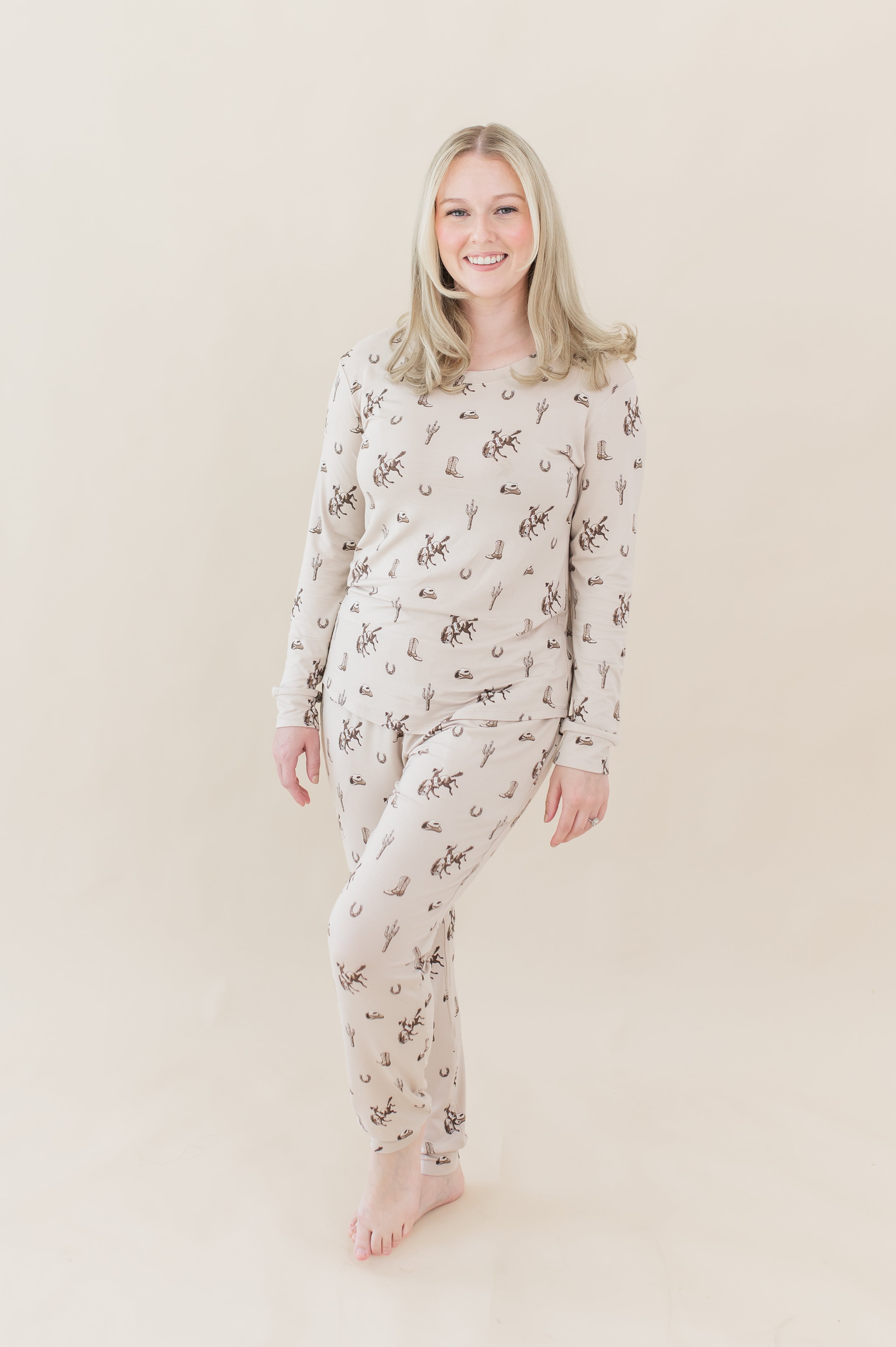 Female model posing wearing the Women's Jogger Pajama Set in Classic Cowboy in front of a light neutral backdrop
