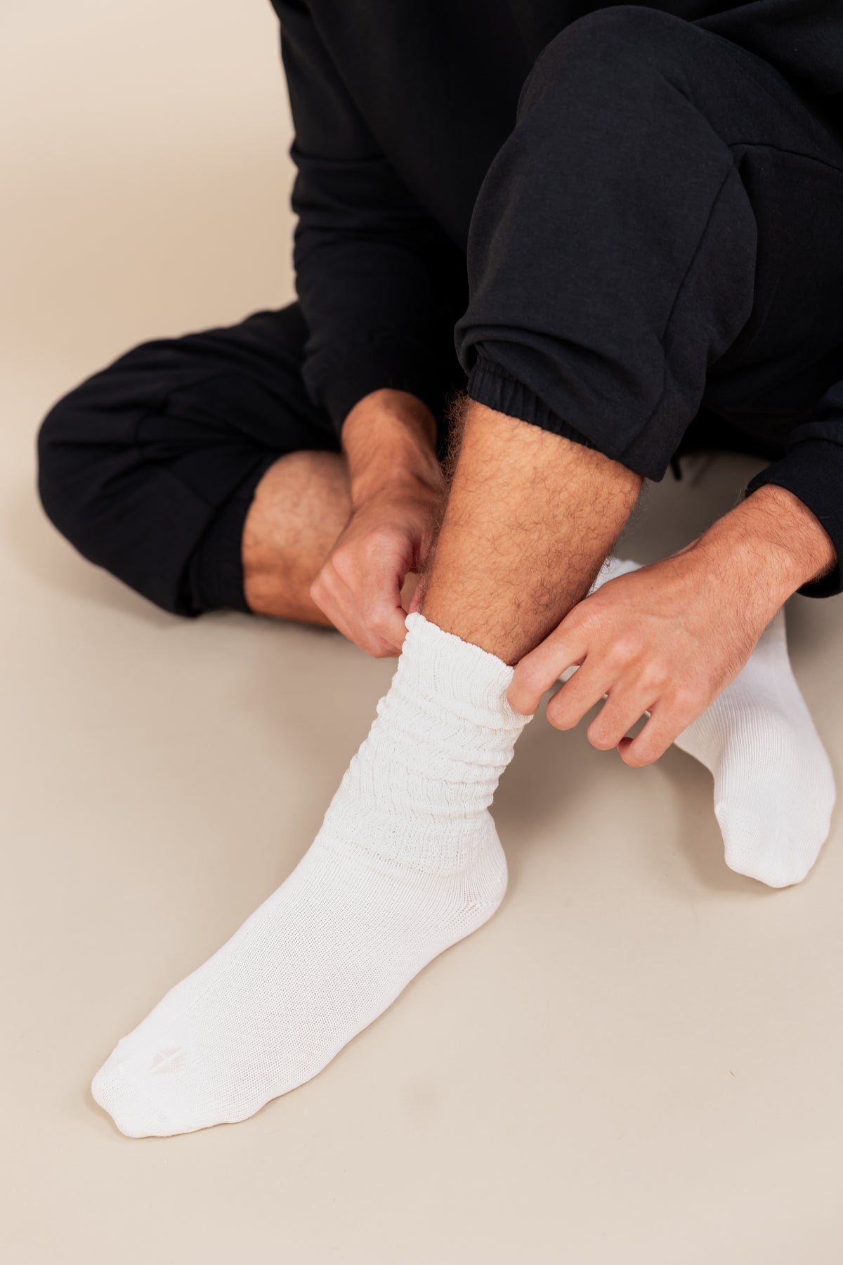Modal wearing Adult Scrunch Socks in Cloud color on a beige background