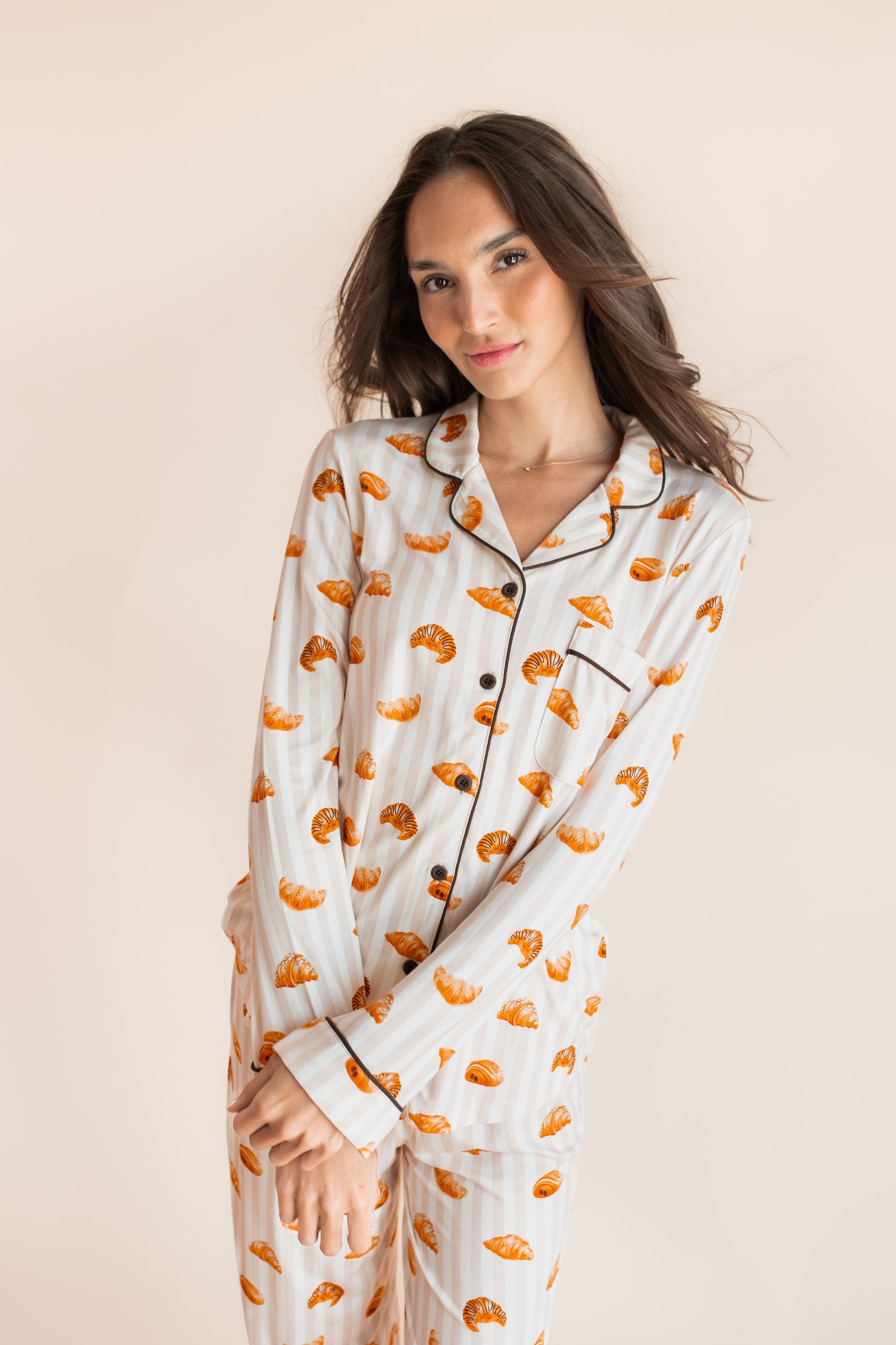 Model wearing Long-Sleeved Women's Pajama Set with Croissant on a beige background