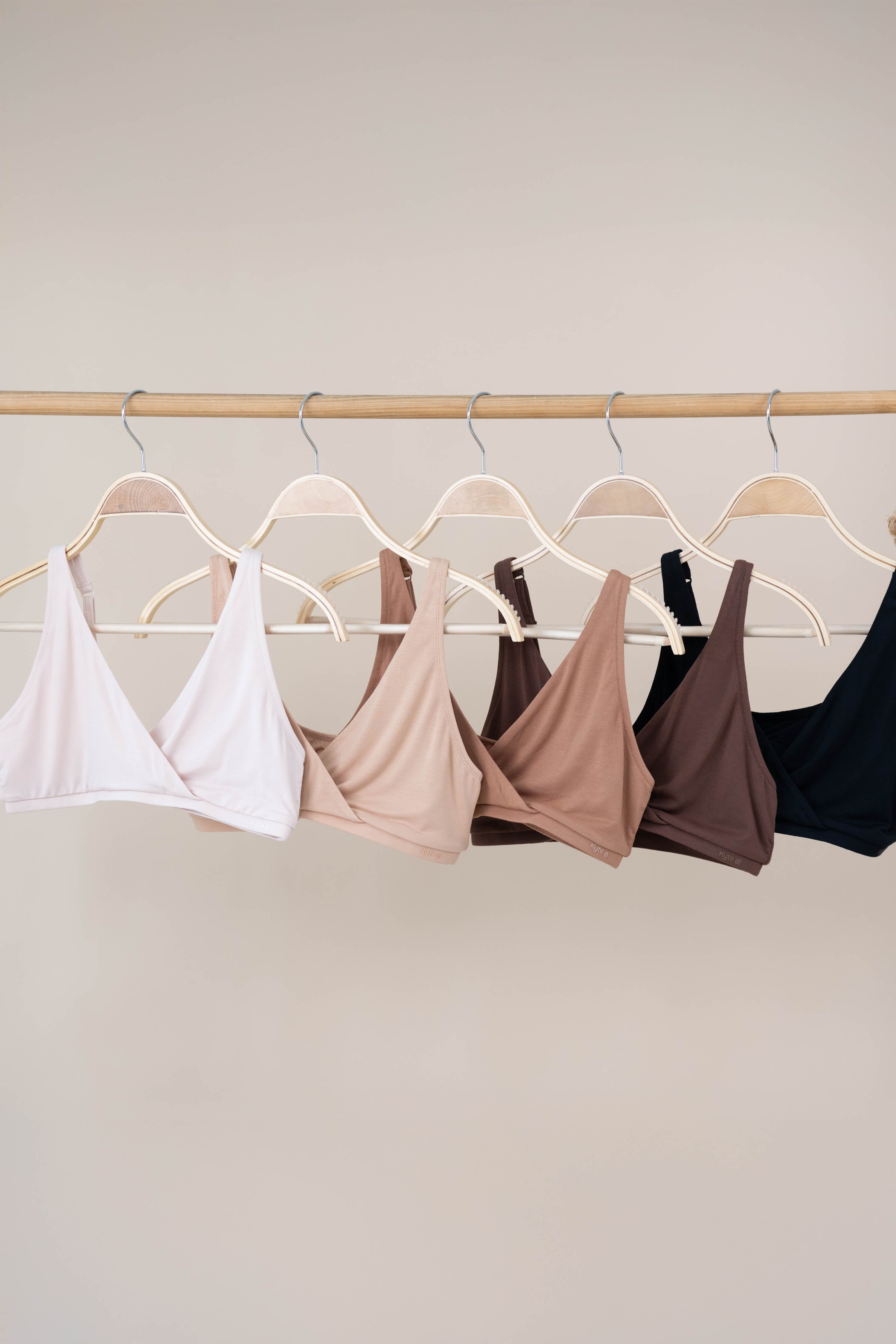 Women's Cross Front Bralette in Neutral colors on hangers