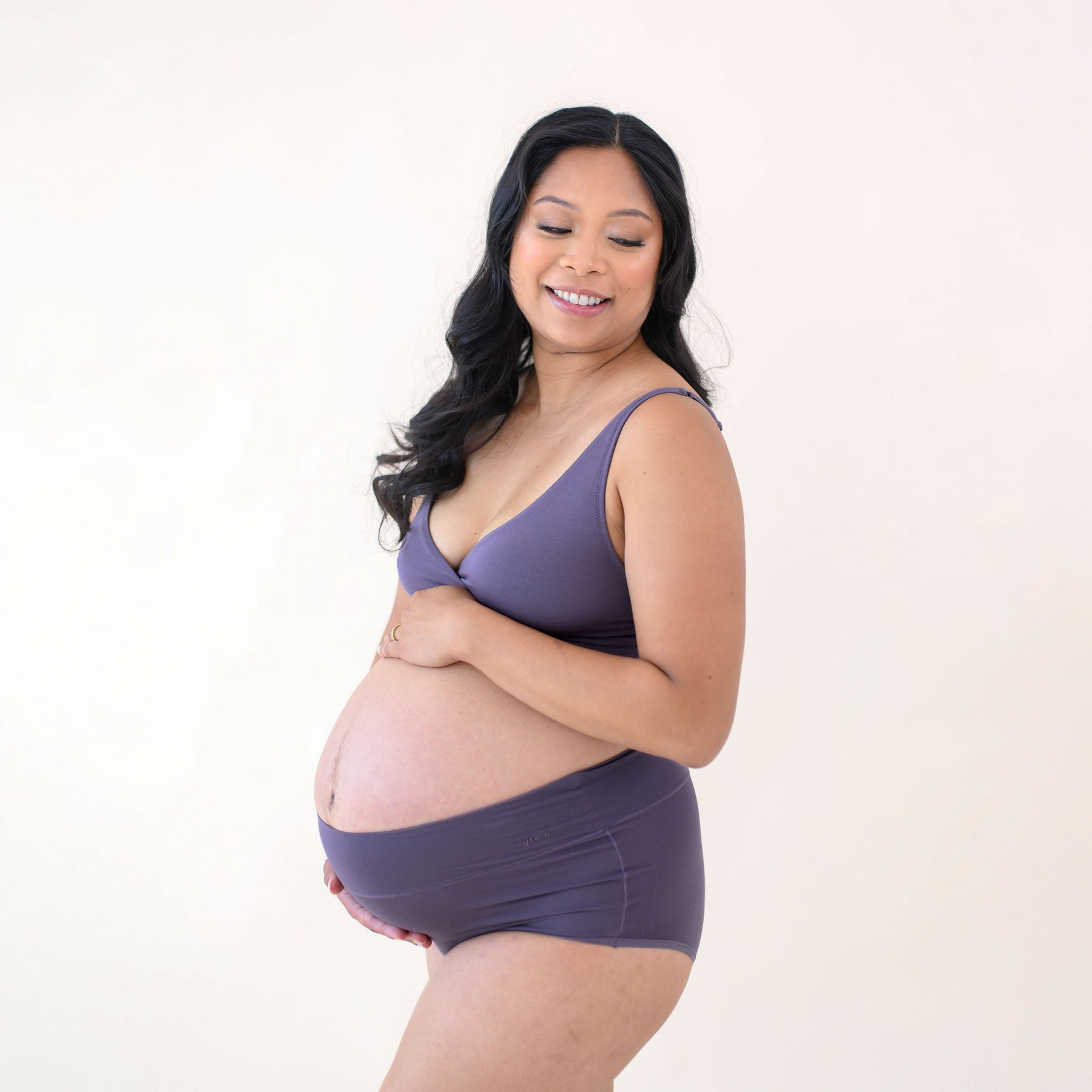 Pregnant woman modeling Women's High-Waisted Brief in Currant