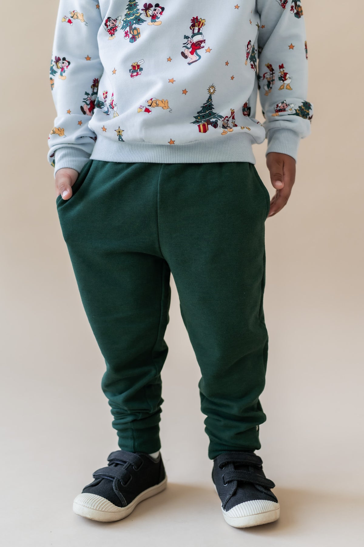 Modal wearing Pant in Cypress on a beige background