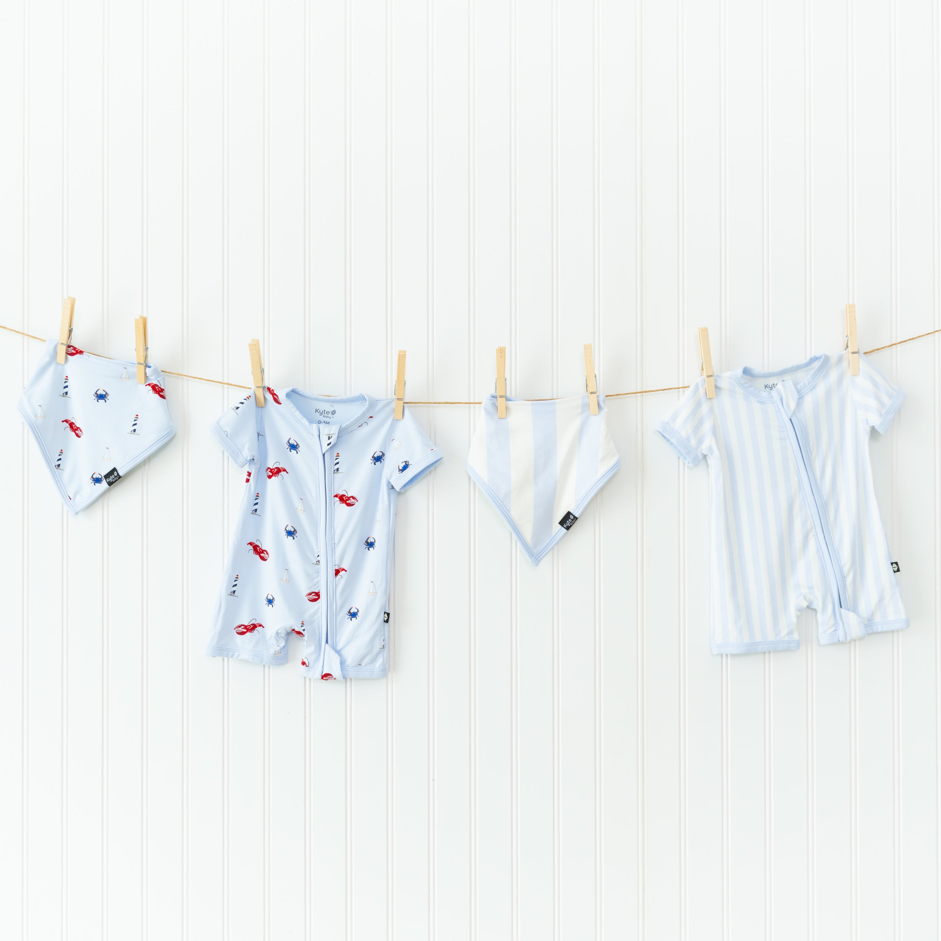 Bibs and shortalls in summer prints hanging from clothesline