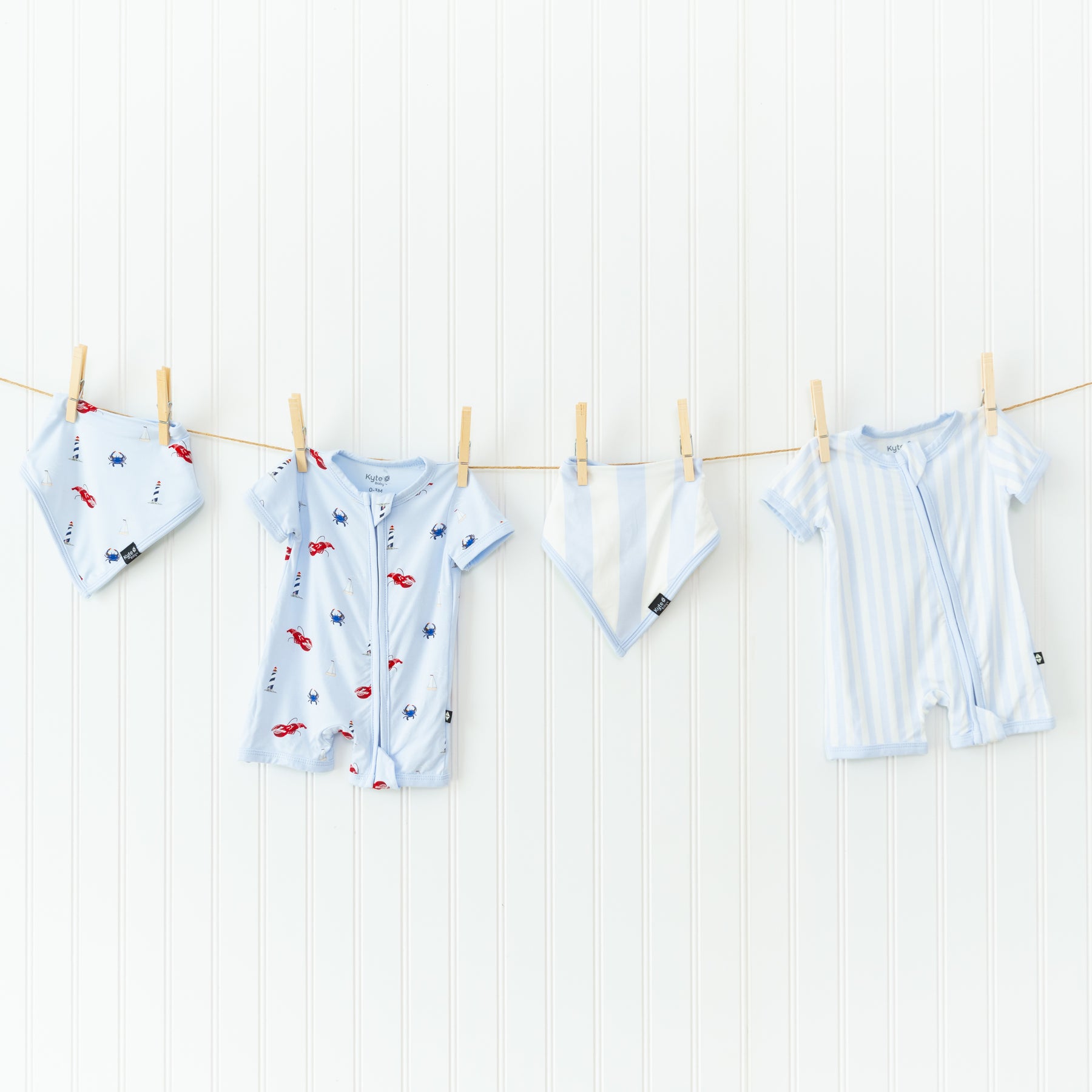 Bibs and shortalls in summer prints hanging from clothesline