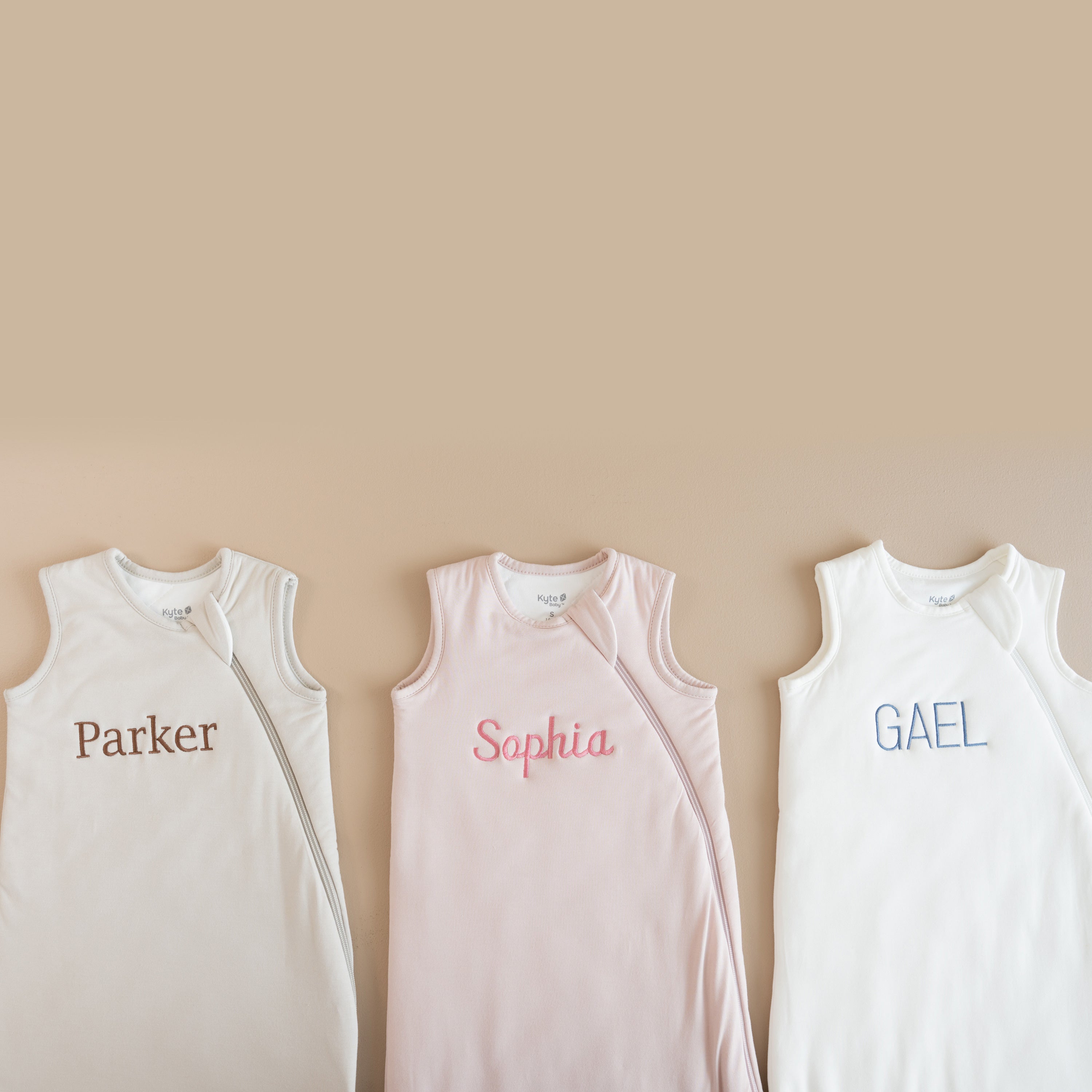 Showing 3 sleep bags with embroidery in 3 different fonts