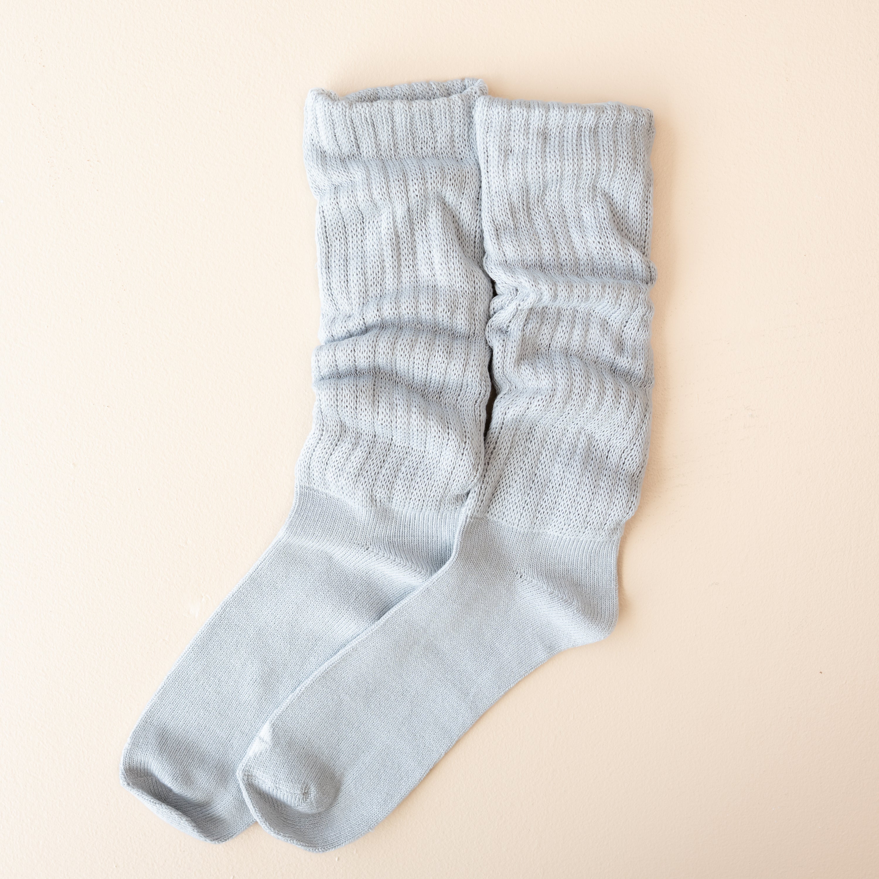 Adult Scrunch Socks in Storm shown out of package side by side on a light neutral background
