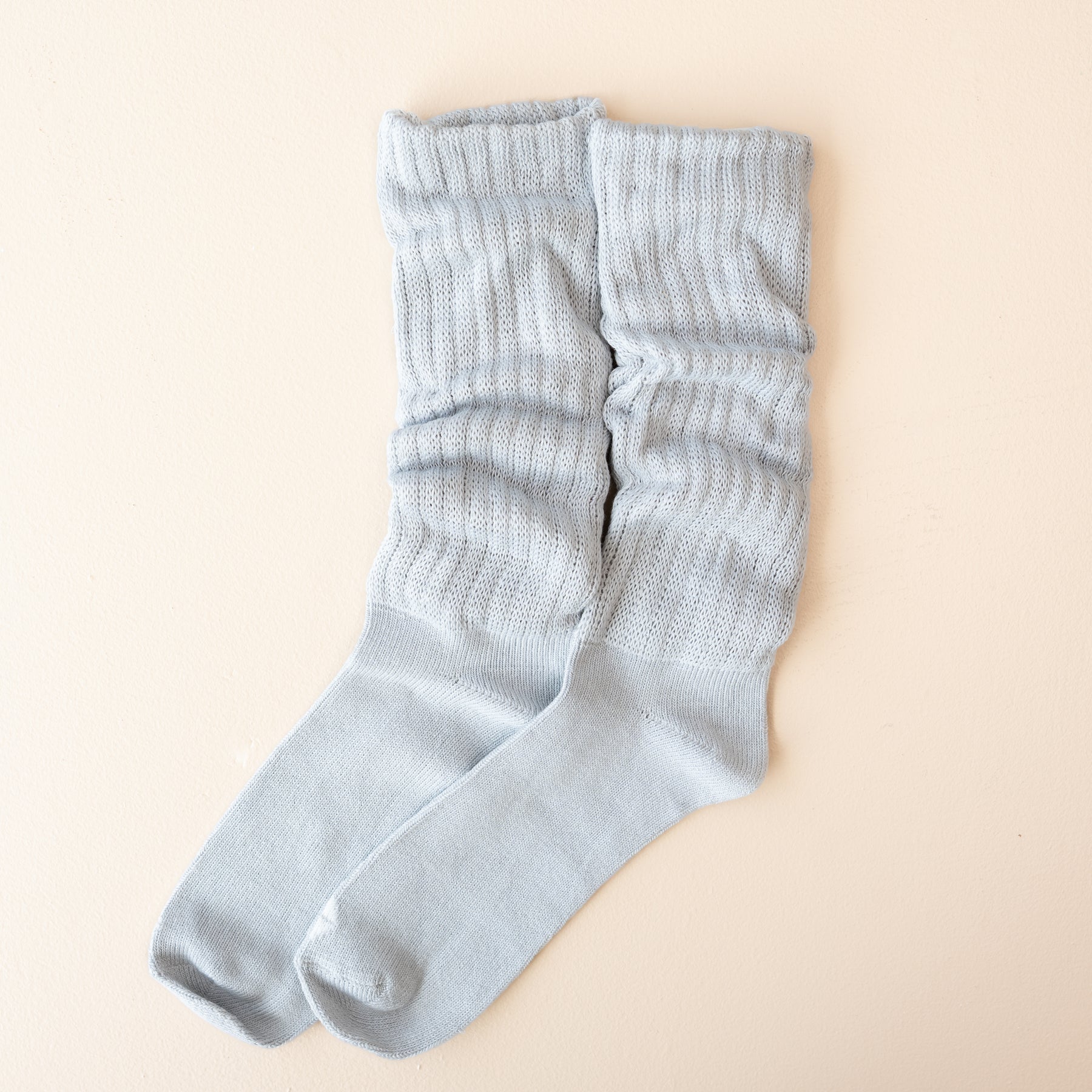 Adult Scrunch Socks in Storm shown out of package side by side on a light neutral background