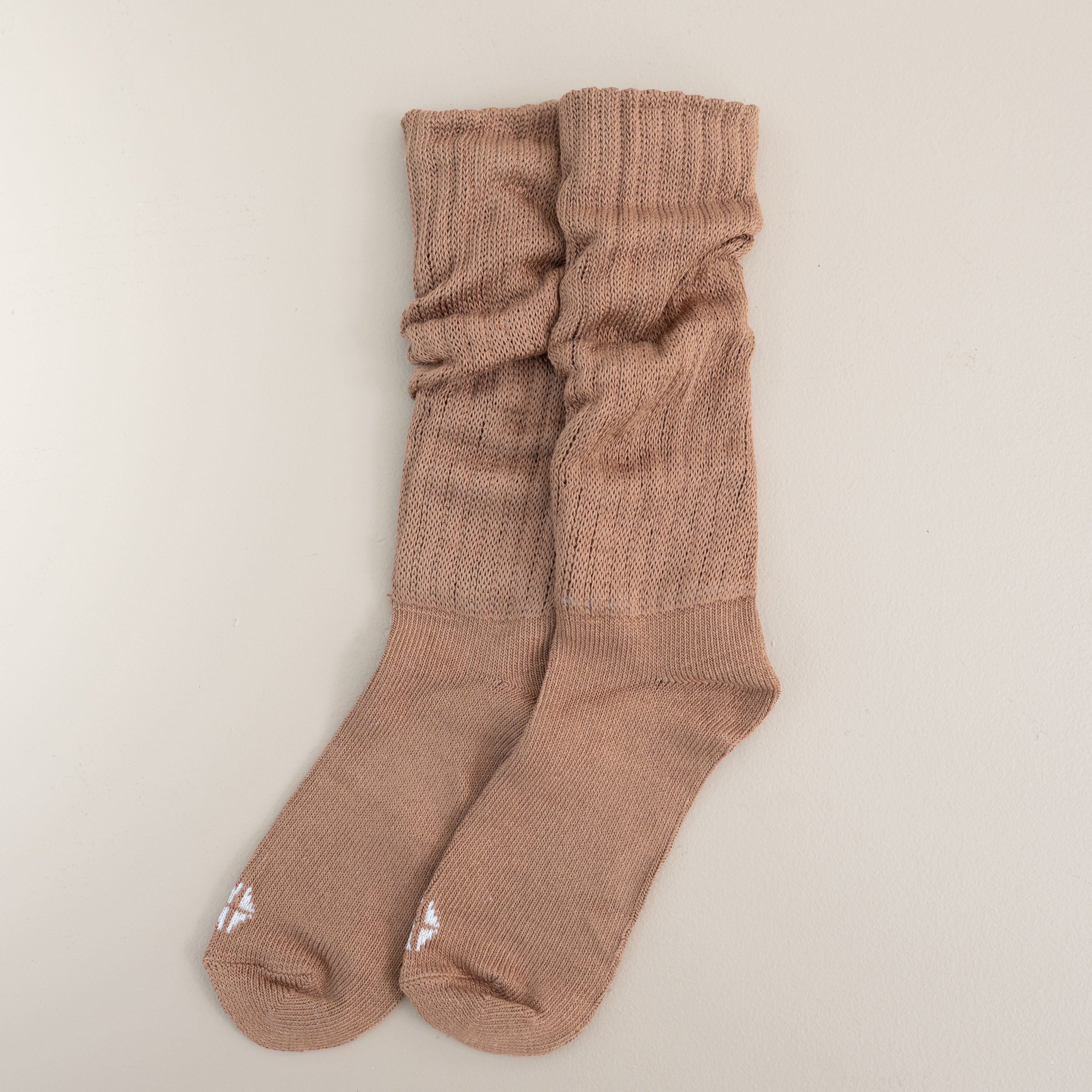Adult Scrunch Socks in Latte shown out of package laid side by side on a light neutral background
