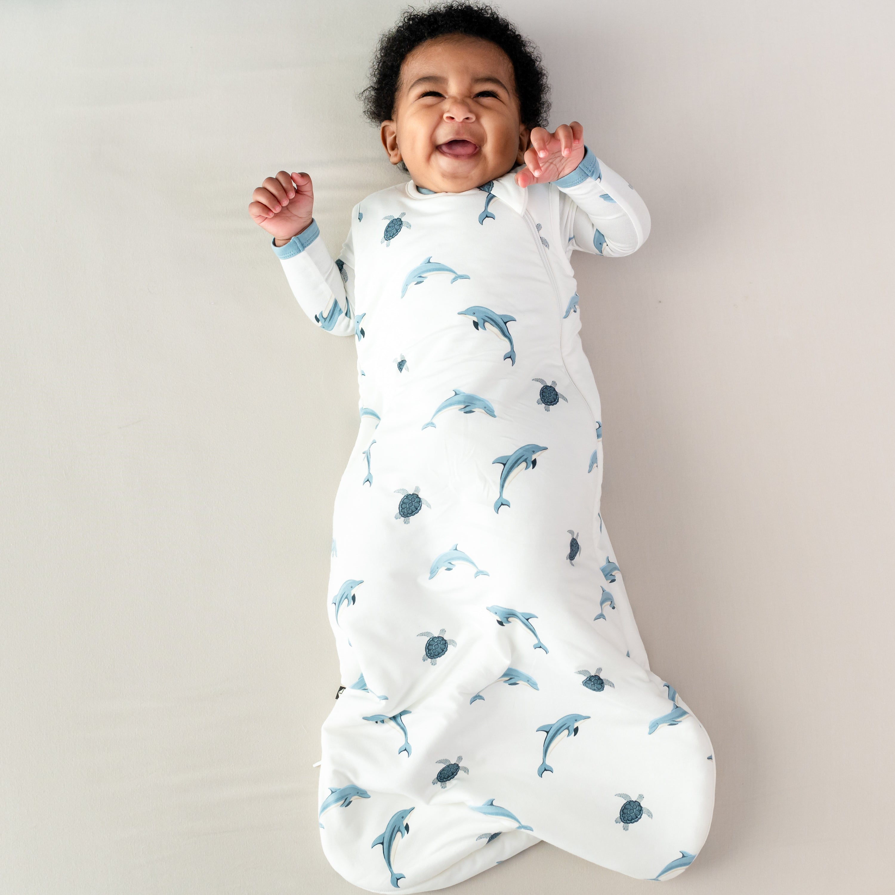 Baby wearing Sleep Bag in Dolphin 1.0