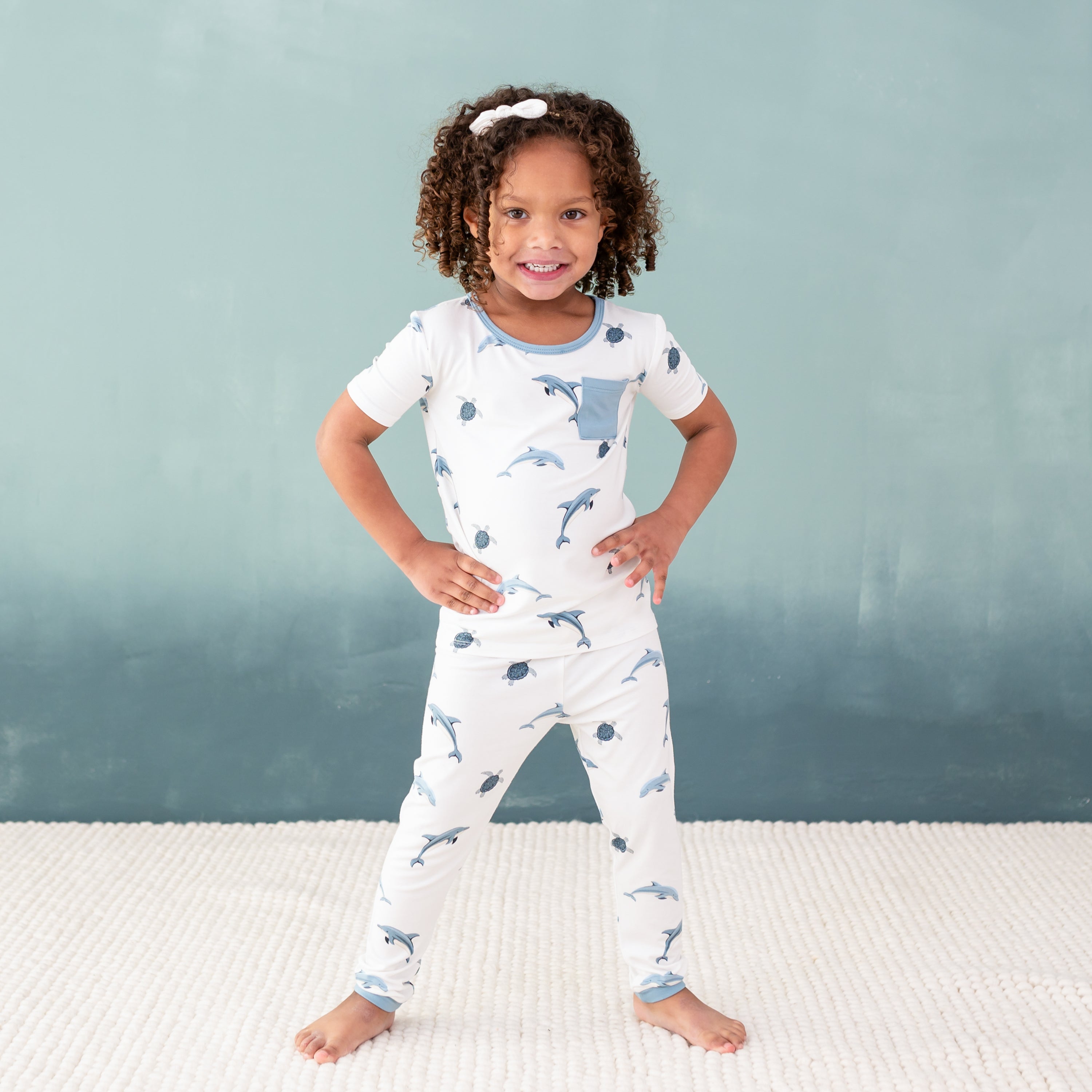 toddler modeling Short Sleeve with Pants Pajamas in Dolphin