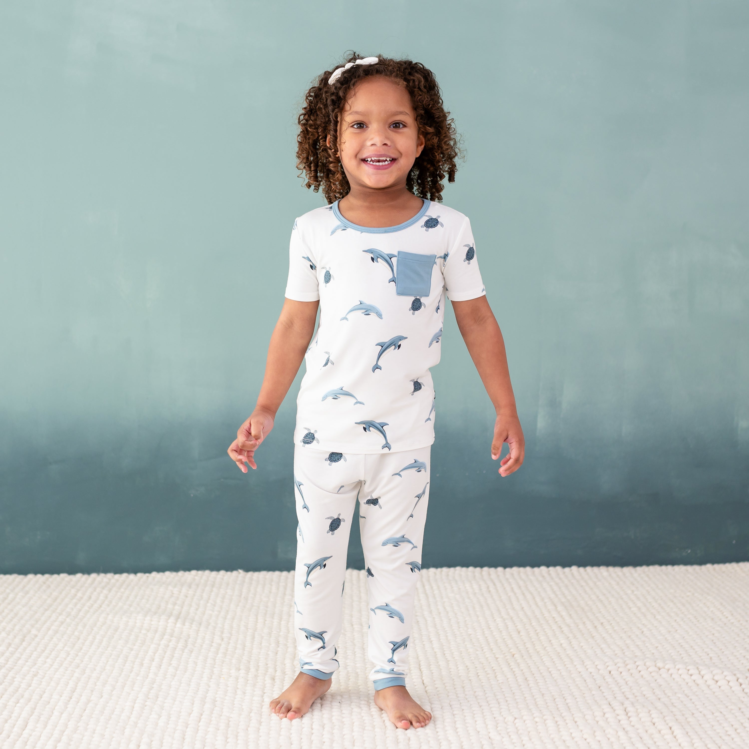 toddler modeling Short Sleeve with Pants Pajamas in Dolphin