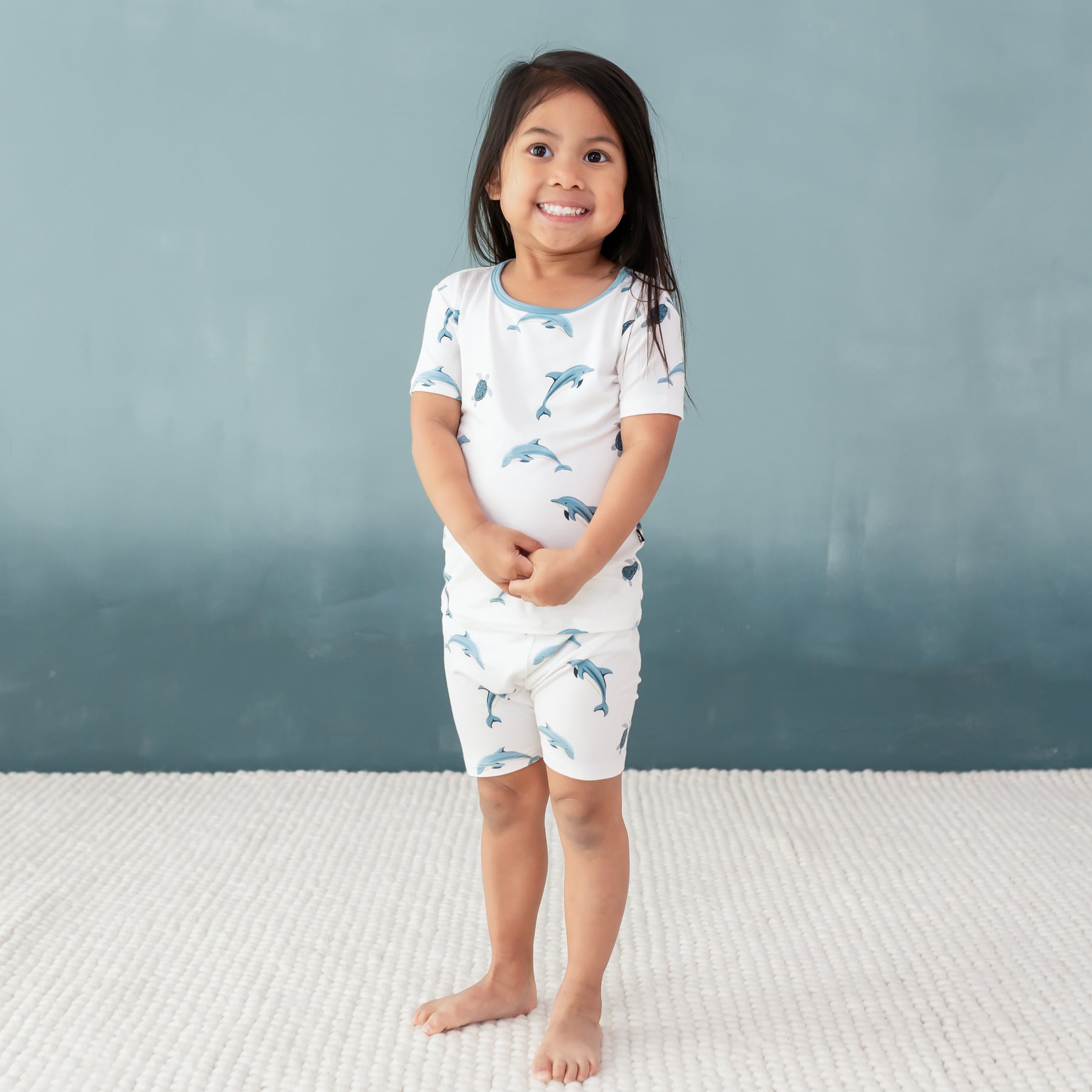 toddler modeling Short Sleeve Pajamas in Dolphin