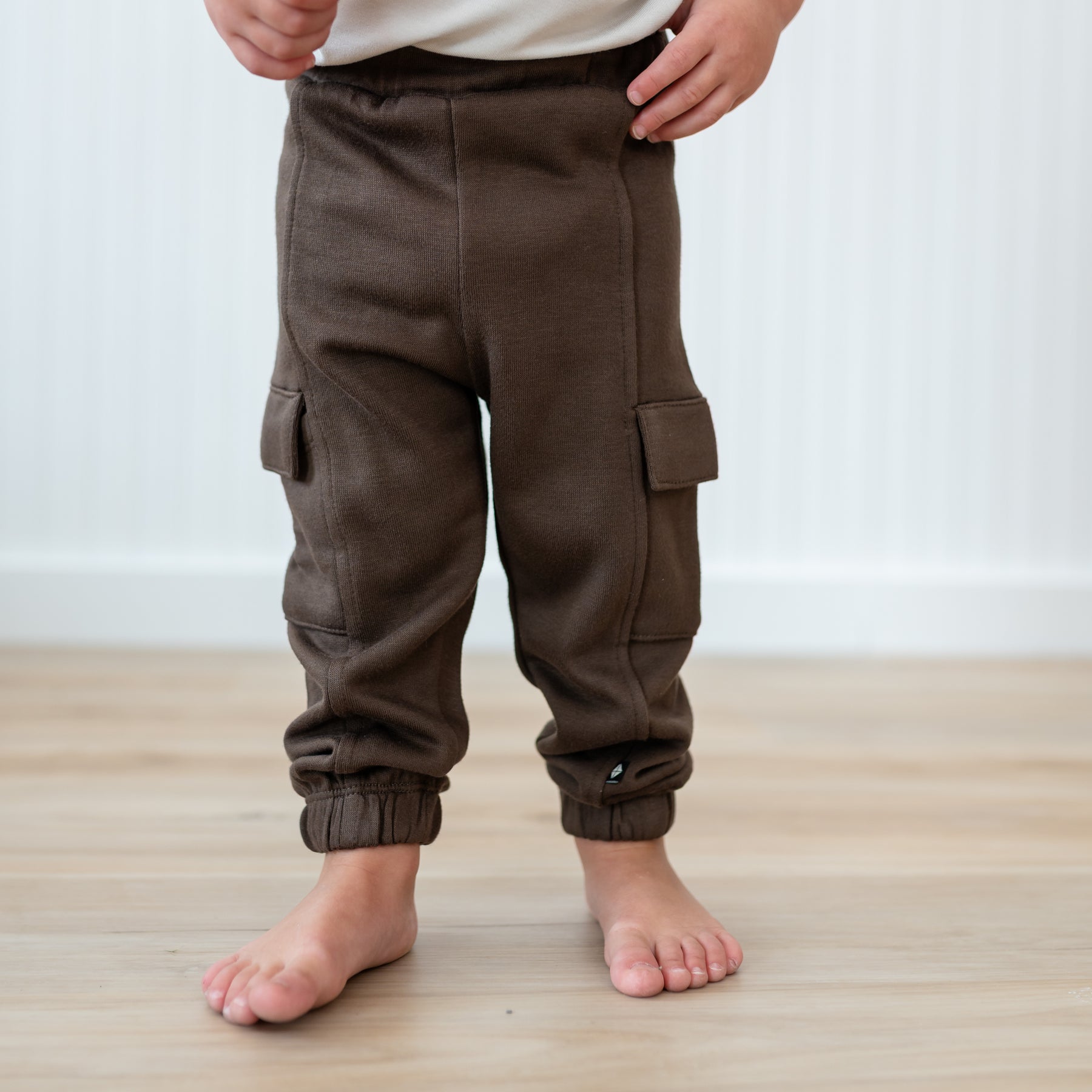 Close up of the Fleece Cargo Pants in Espresso shown on a model
