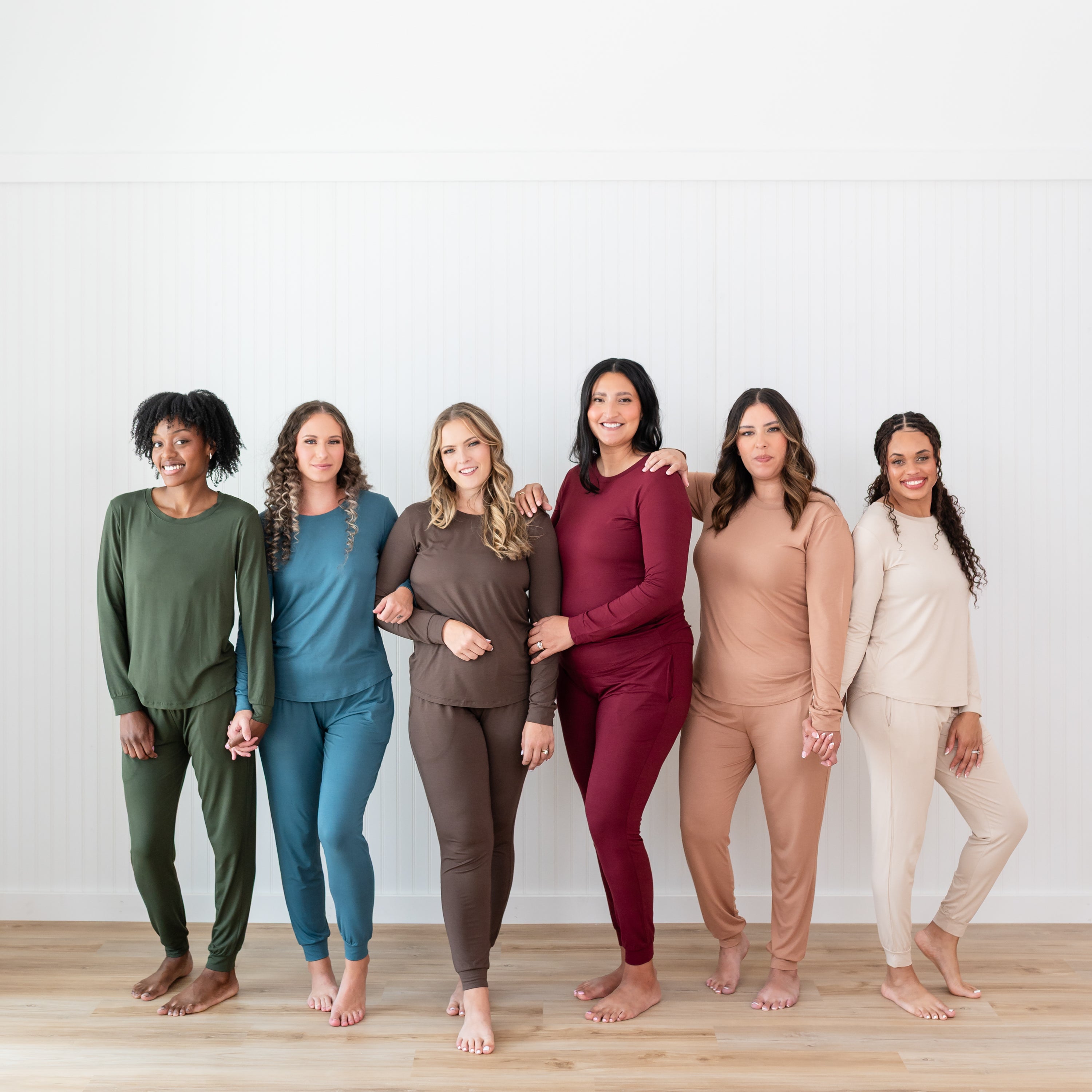 Six female models standing side by side wearing the different fall solids