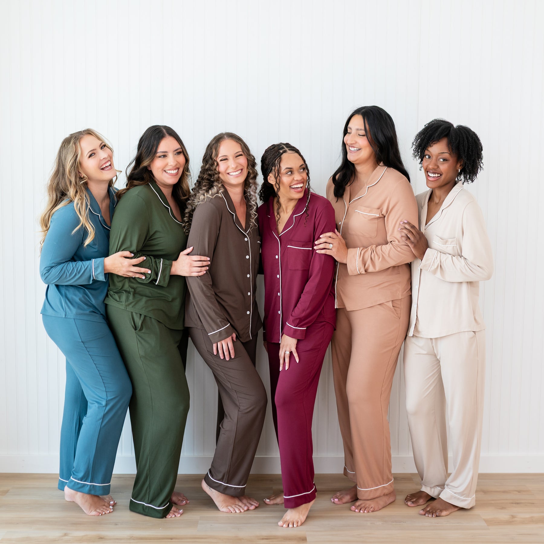 Six women standing side by side wearing the Women's Long sleeve Pajama set in fall colors