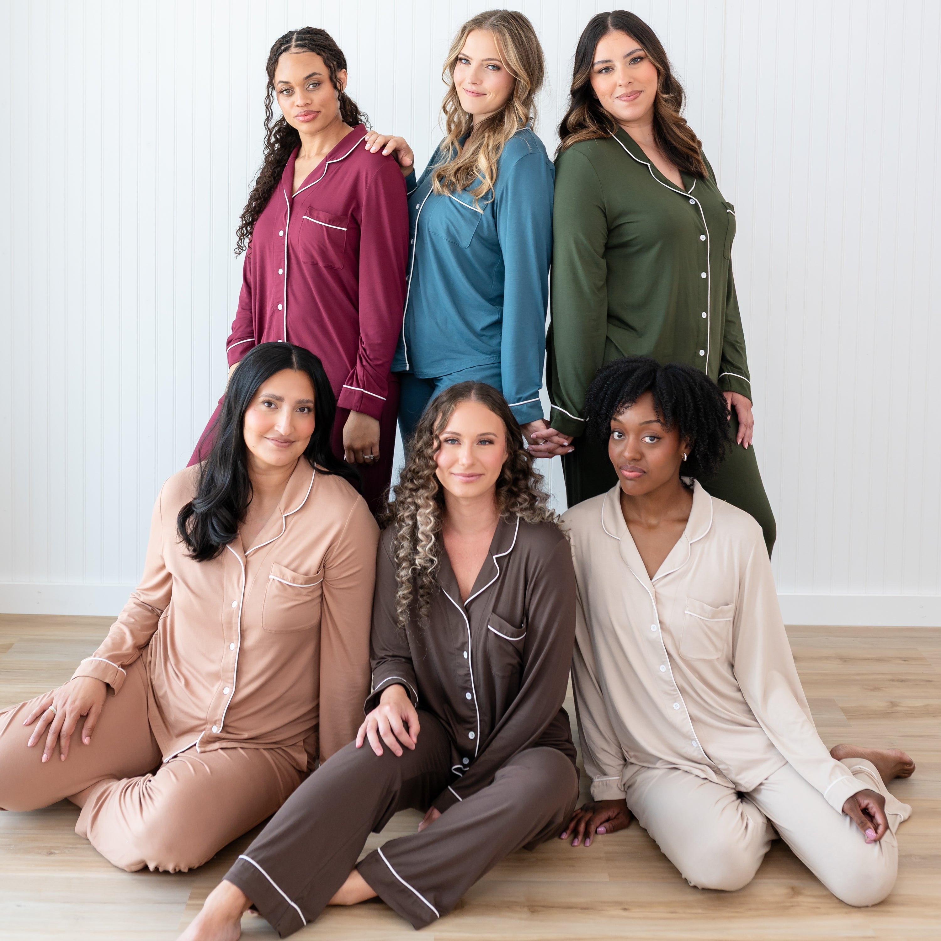 Group photo of female models wearing the Long-Sleeved Women's Pajama Set in the fall colors with cloud trim