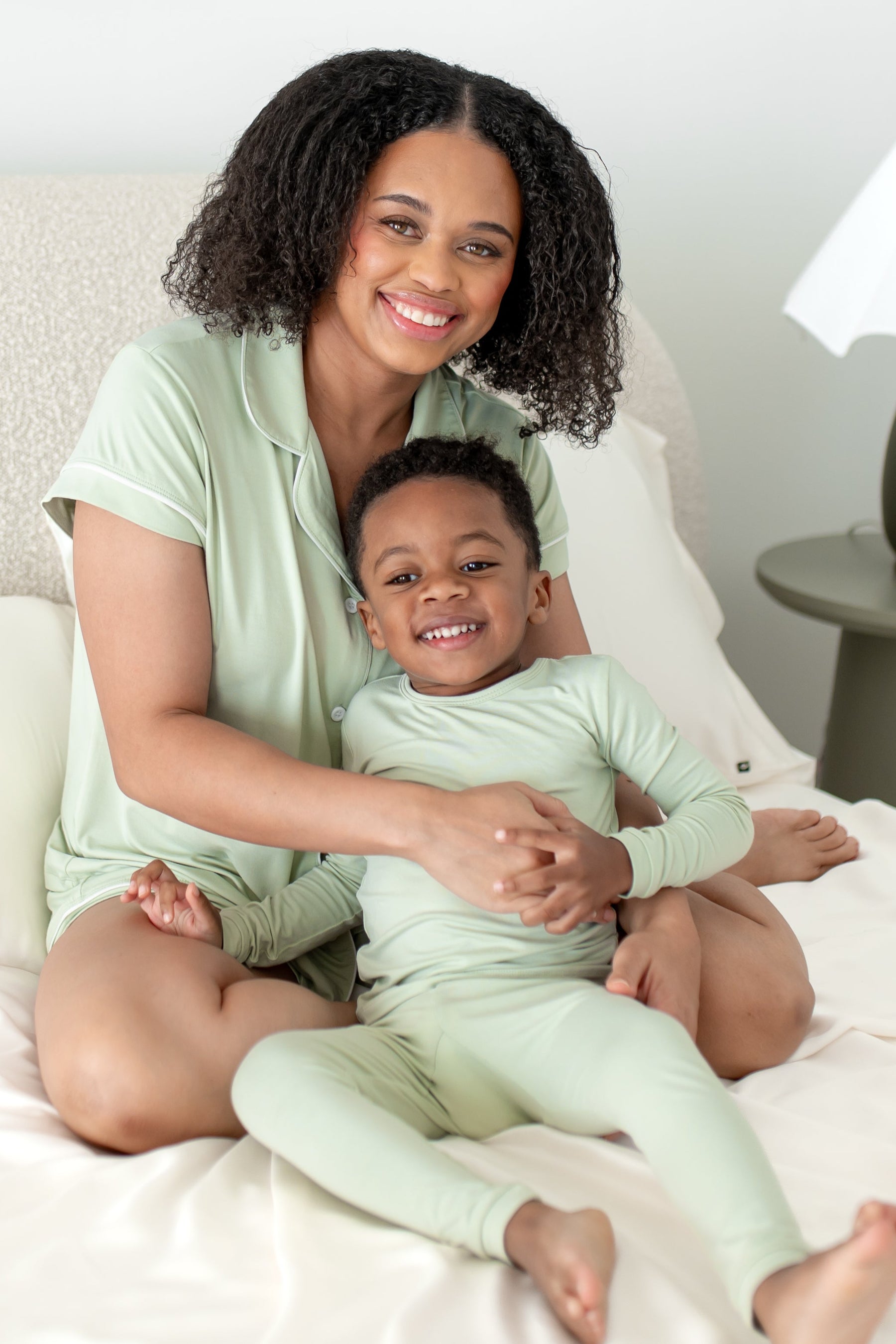 Woman and child wearing mommy and me matching light green pajamas