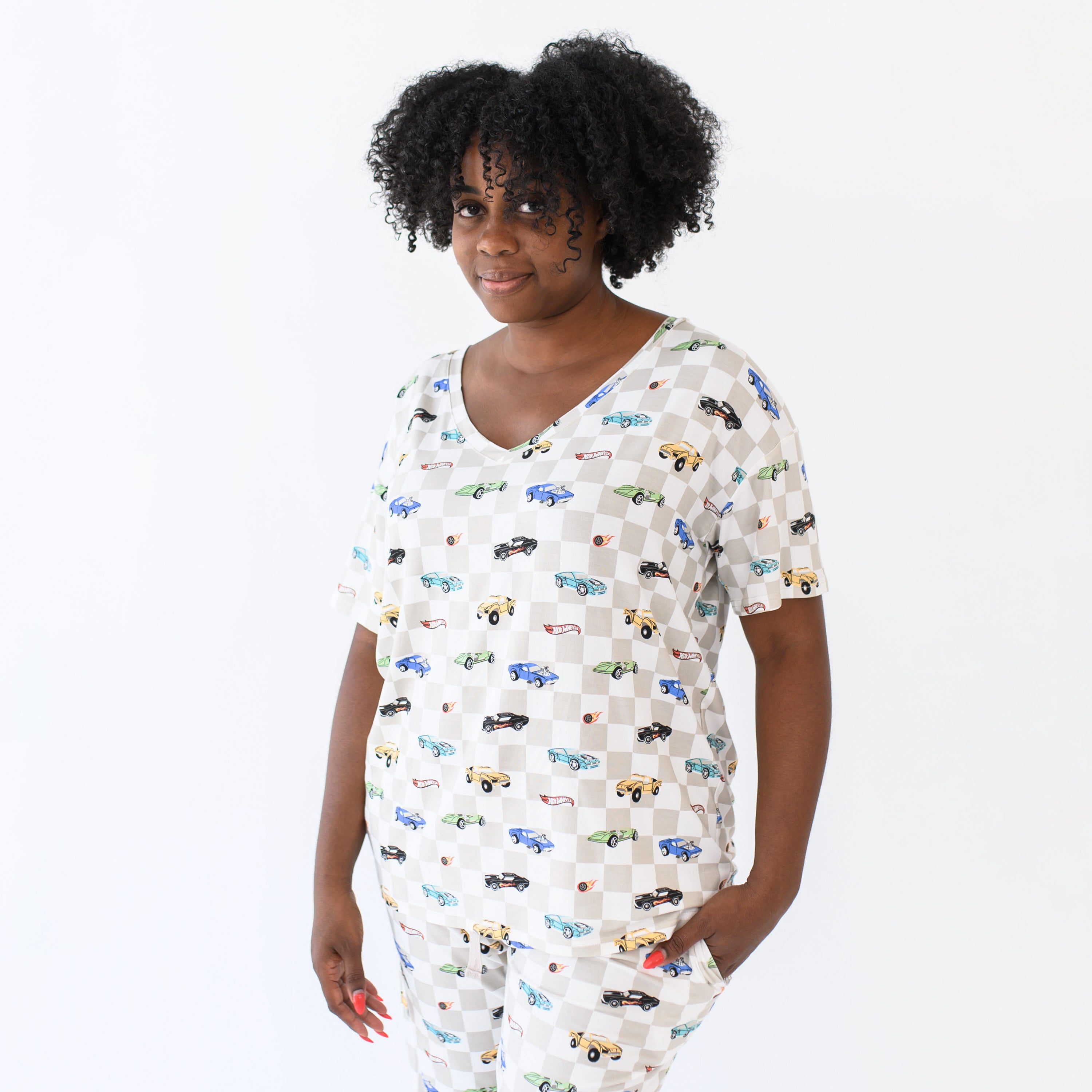 Female model wearing the Women's Relaxed Fit V-Neck in Fast and Fierce and matching lounge pant with hand in the pocket