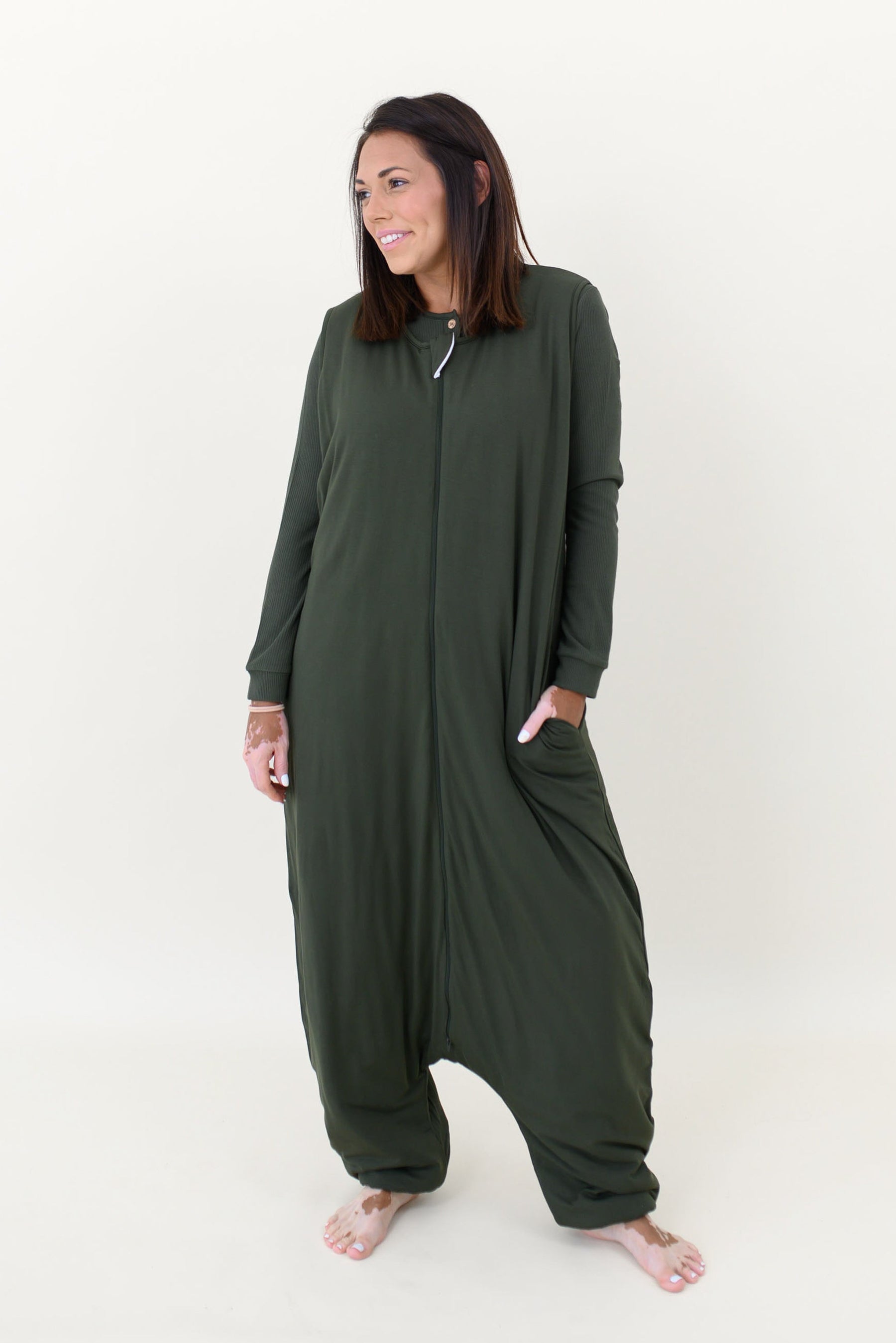 Woman modeling Adult Sleep Bag Walker in Fir showing side pocket against a white background