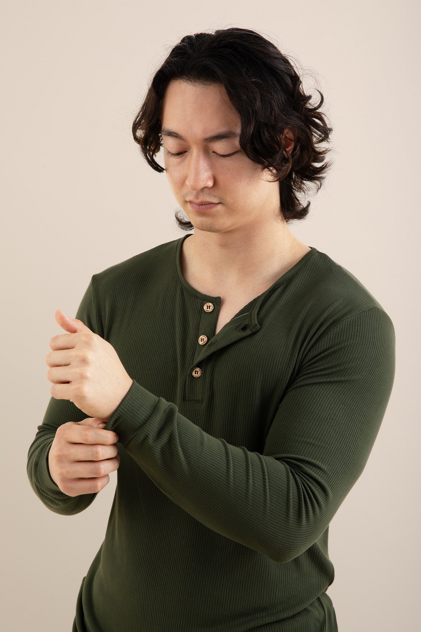 The shirt of the Men's Ribbed Henley Set in Fir shown on a model