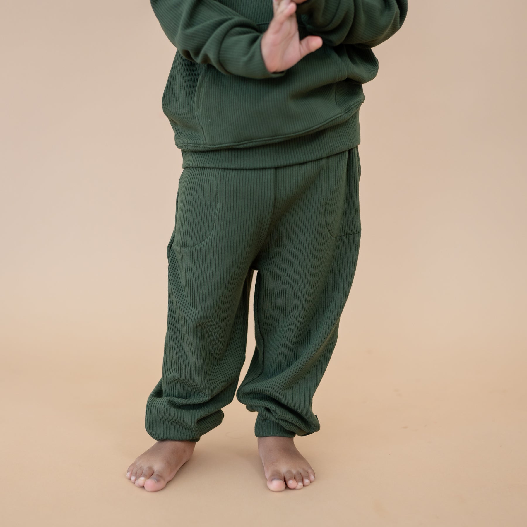 Close up of the Ribbed Jogger Pant in Fir shown on a model