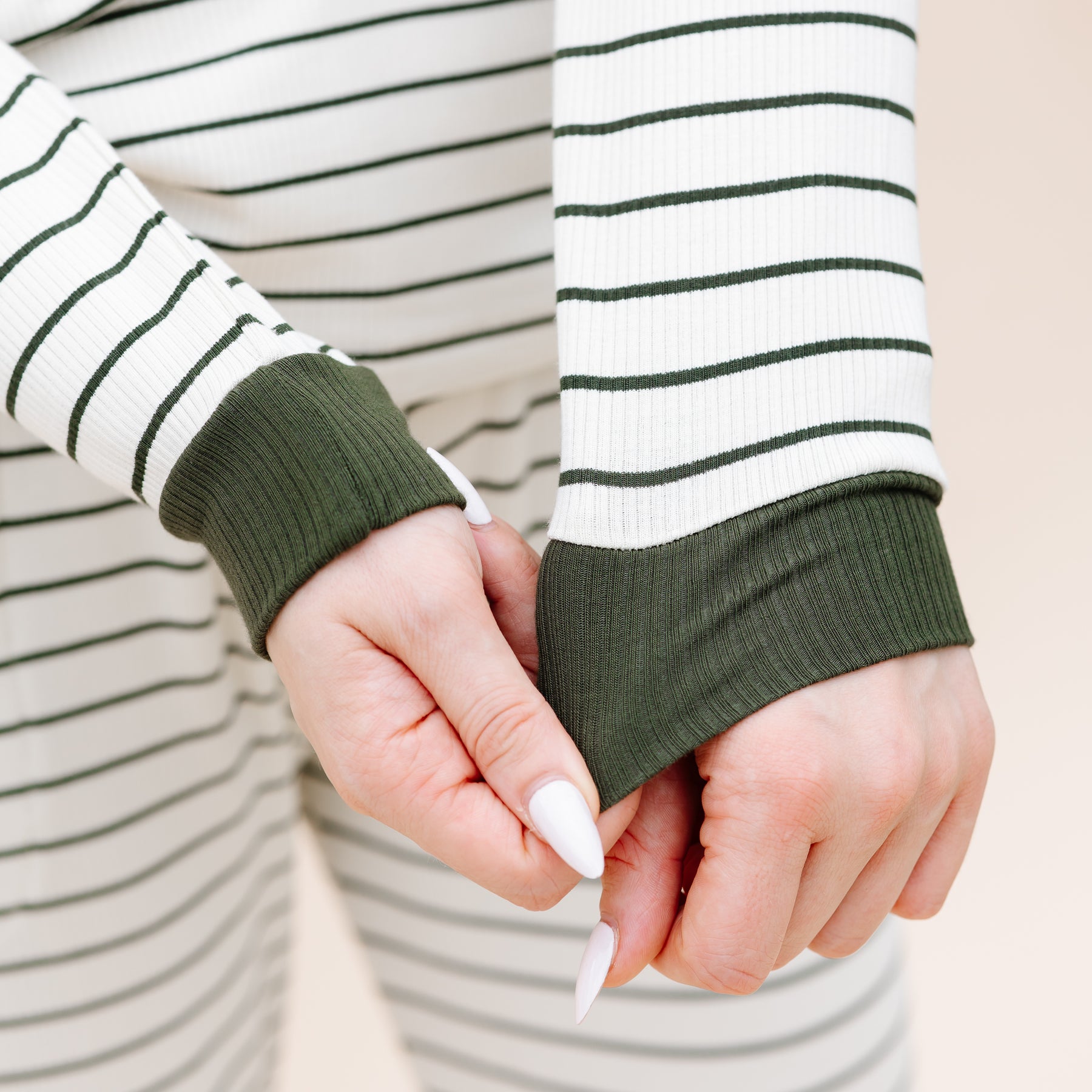 Close up of the green ribbed wrist cuff on the Women’s Ribbed Henley Set in Fir Stripe