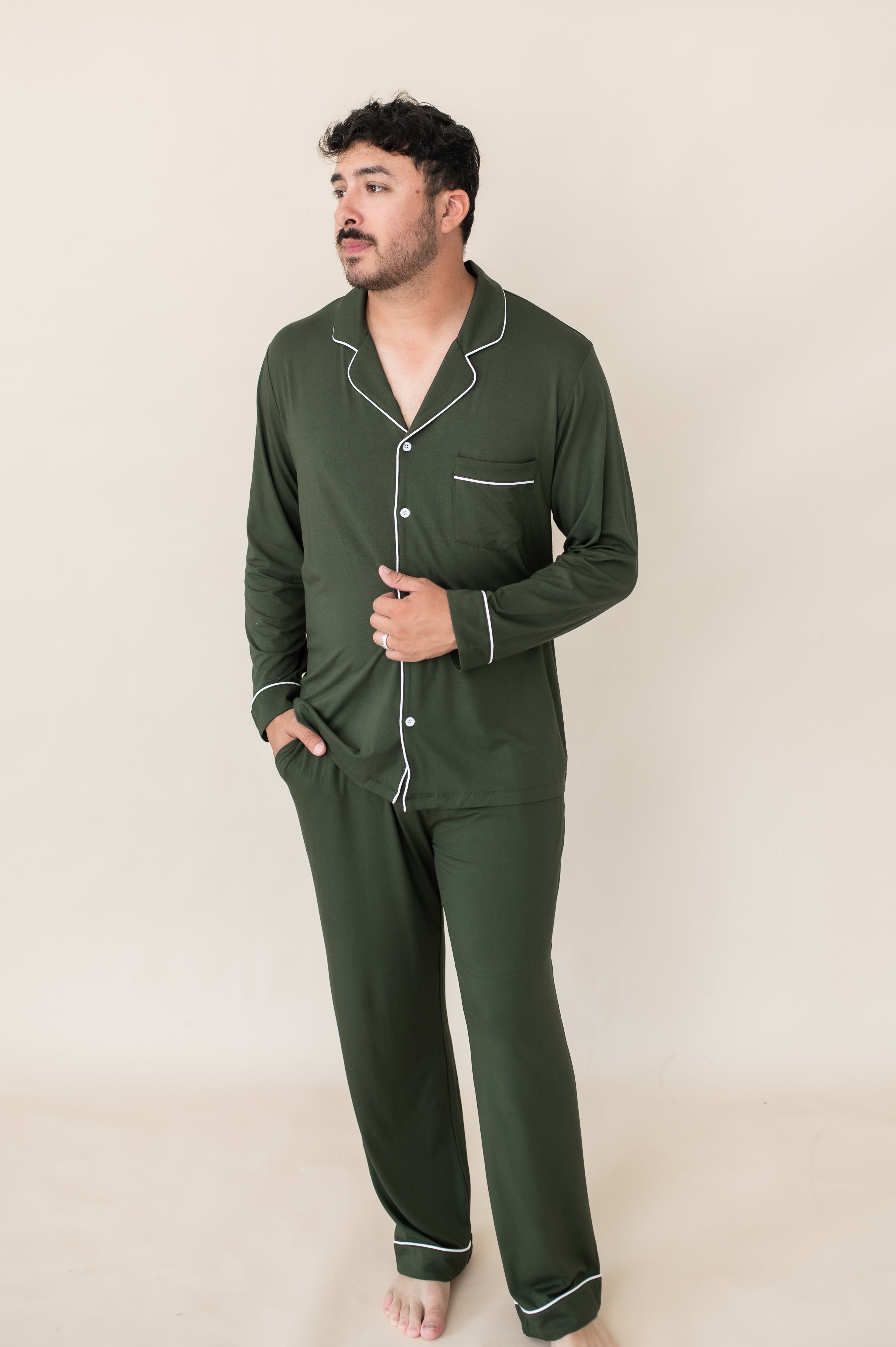 Male model wearing the Men's Long Sleeve Pajama Set in Fir with one hand in the pants pocket