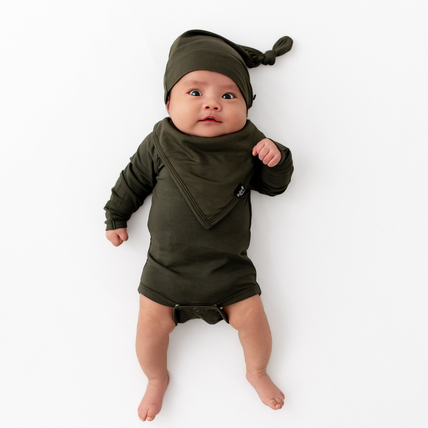 Baby in Fir long sleeve bodysuit with matching knotted cap and bib