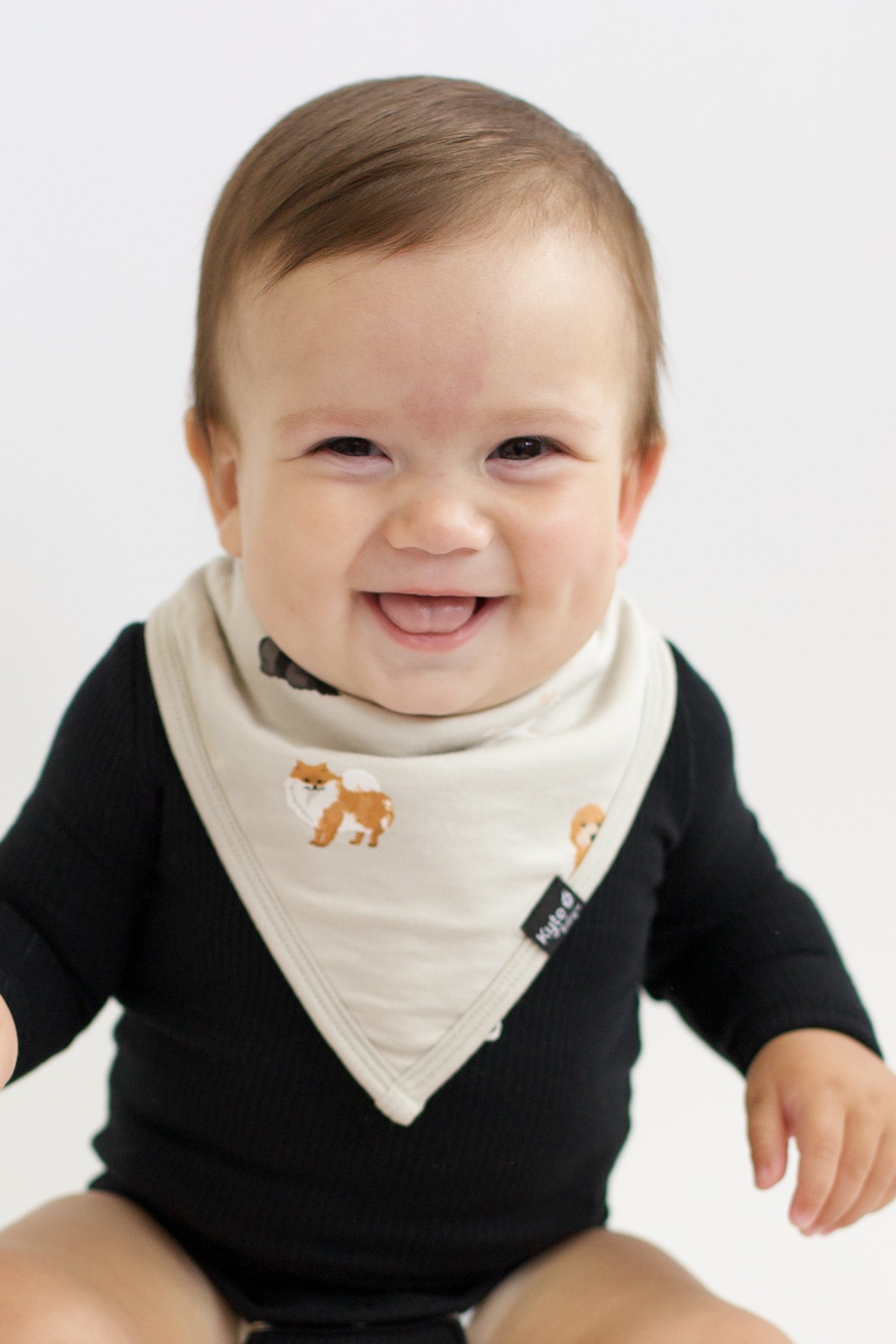 Baby wearing Bib in Fluffy Dog and Midnight Long Sleeve Bodysuit