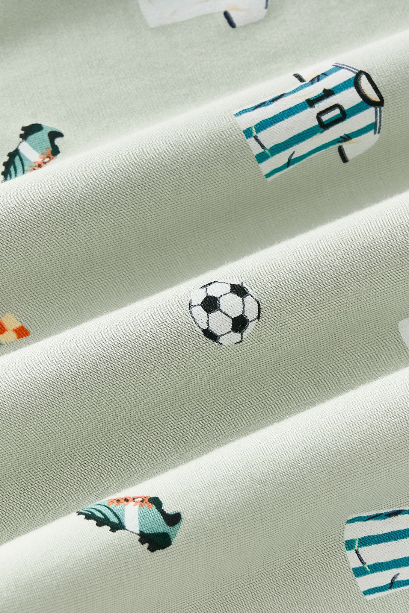 Close up of soccer print on green fabric