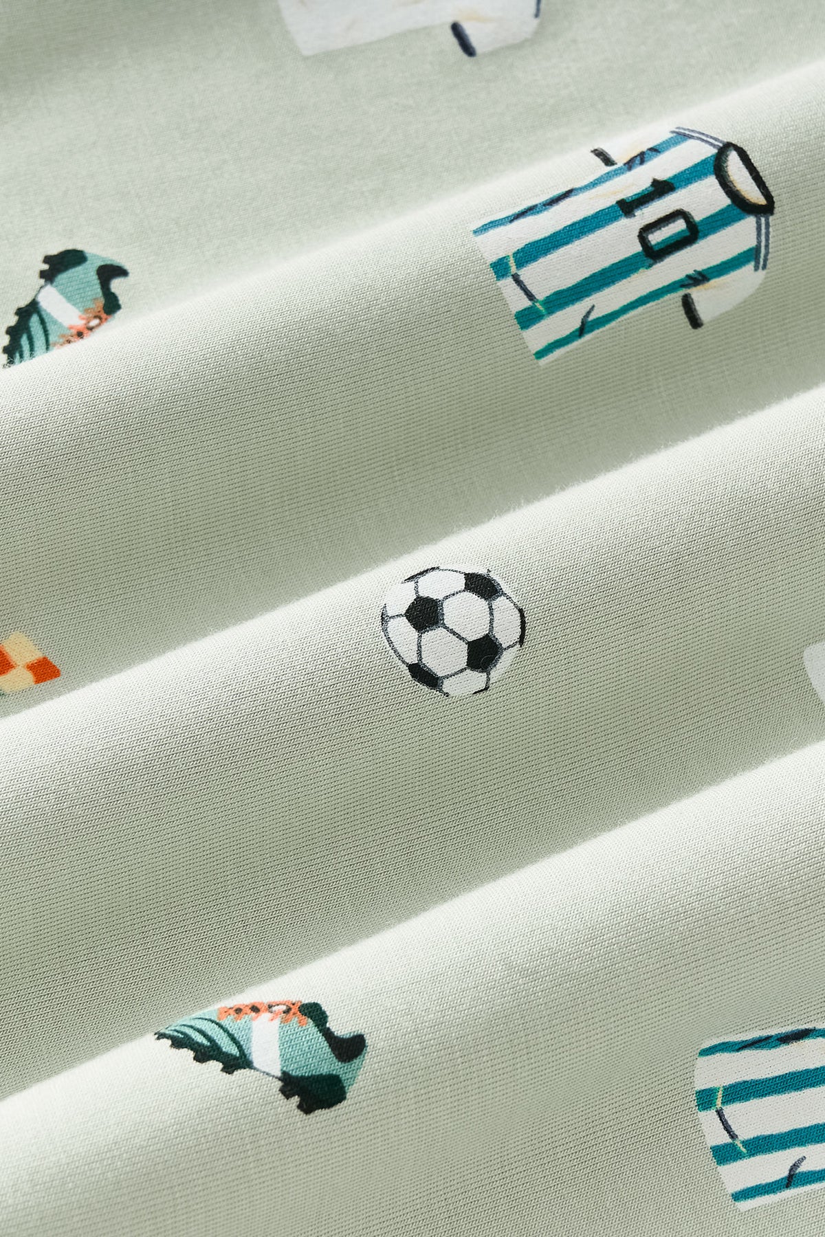 Close up of soccer print on green fabric