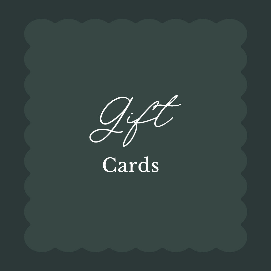 A square gift card design with a dark green background, scalloped inner border, and white text reading 'Gift Cards'.