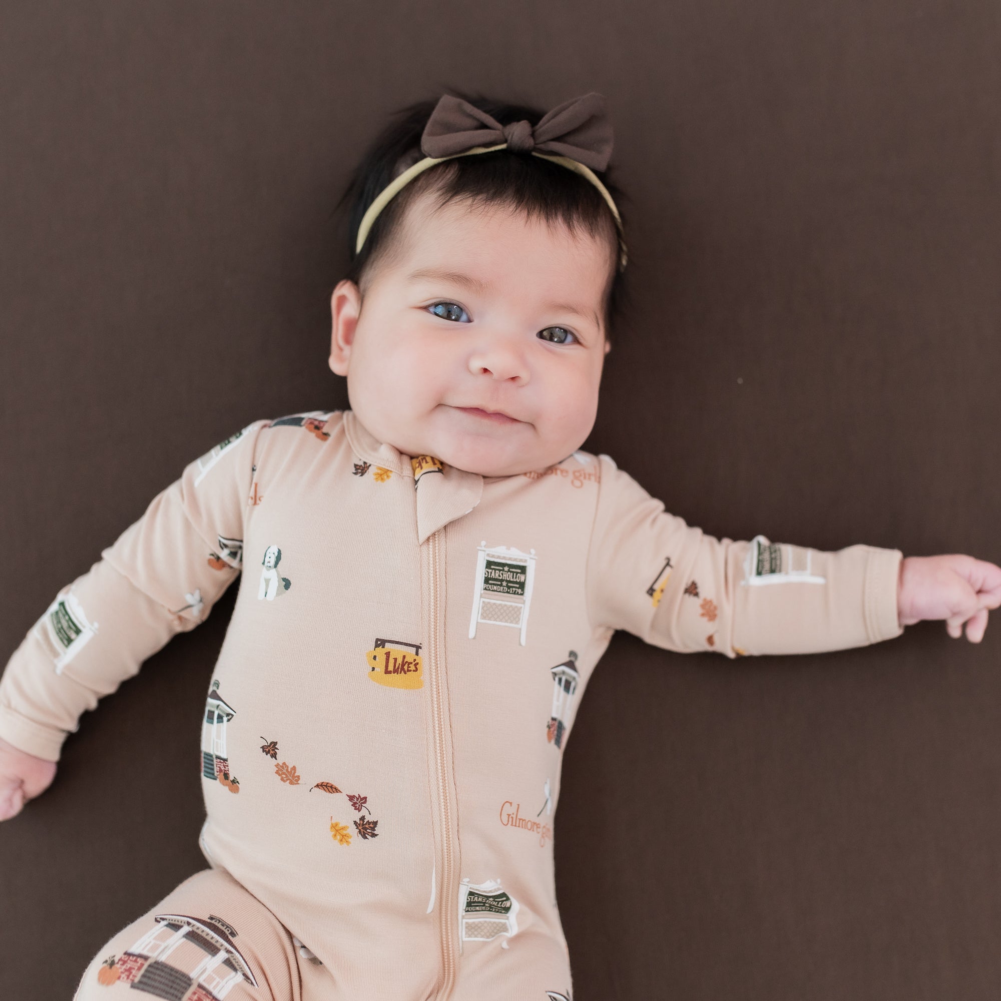 Close up of the Zippered Footie in Gilmore Girls shown on an infant girl