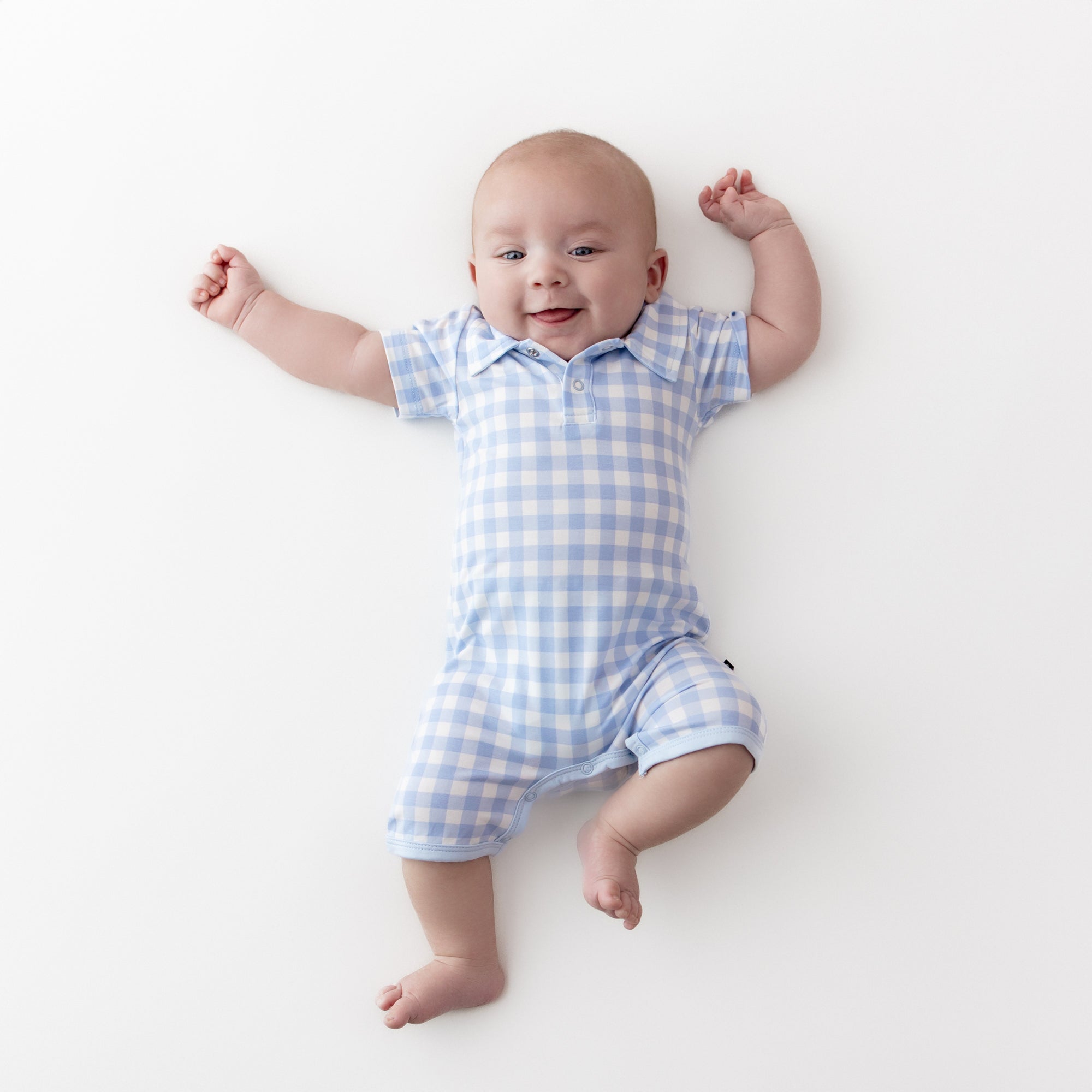 Young boy wearing the Polo Shortall in Gingham Breeze